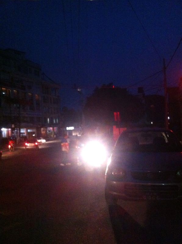Exchanging luggage in the dark streets of Kathmandu