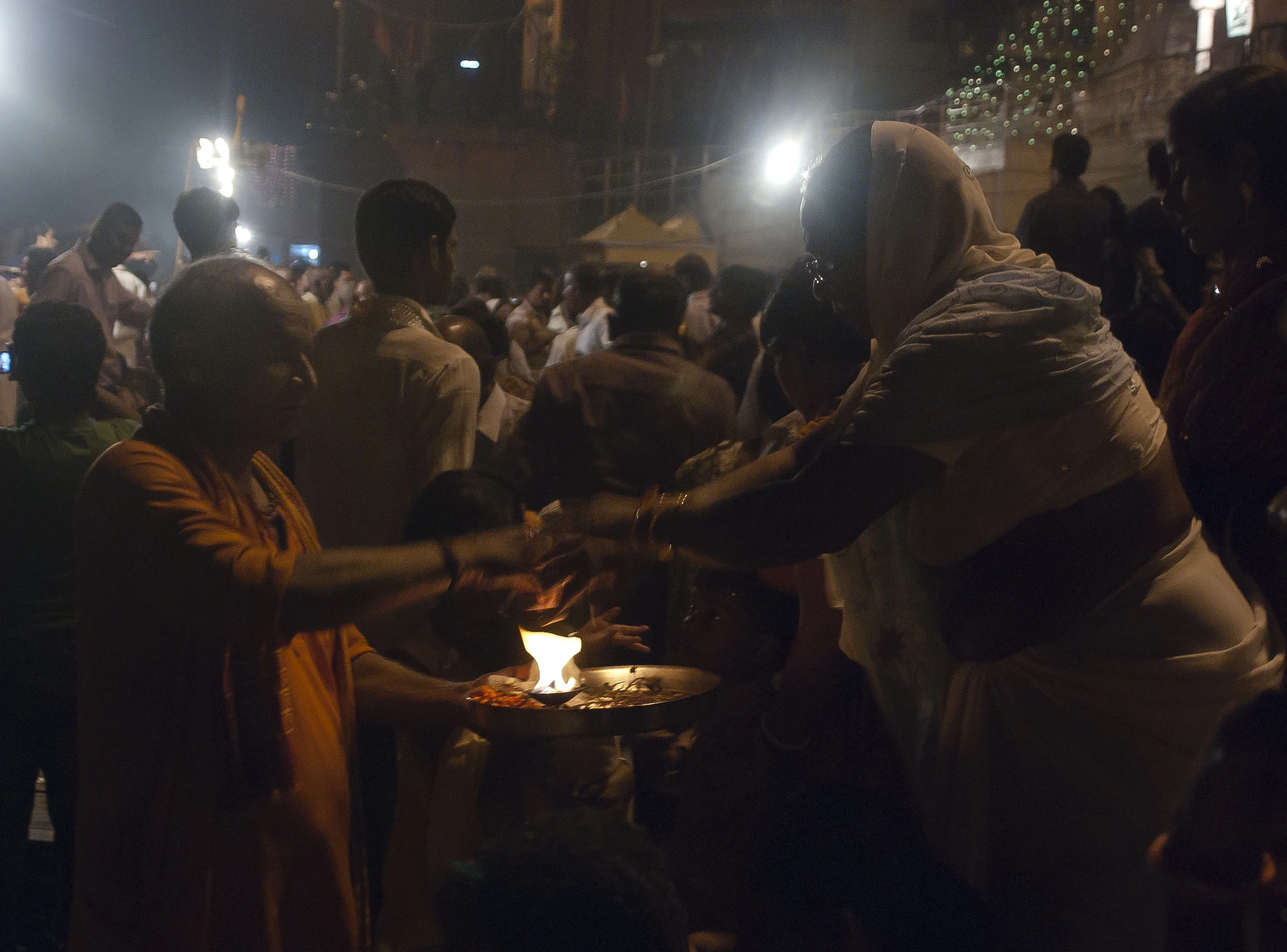 A woman bathes herself in fire at the start of the nightly ceremony. 