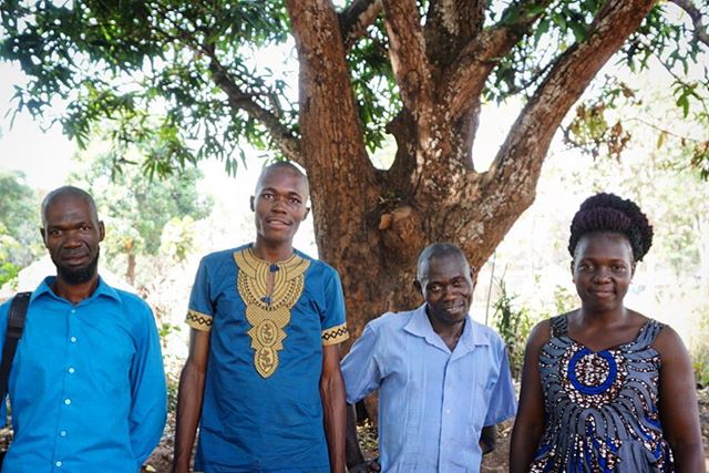 William, Nelson, Peter, and Christine stand under the mango tree where they host support groups for people affected by sexual and gender based violence at the Rimenze IDP camp in South Sudan. 
The majority of the staff are residents of the IDP camp a