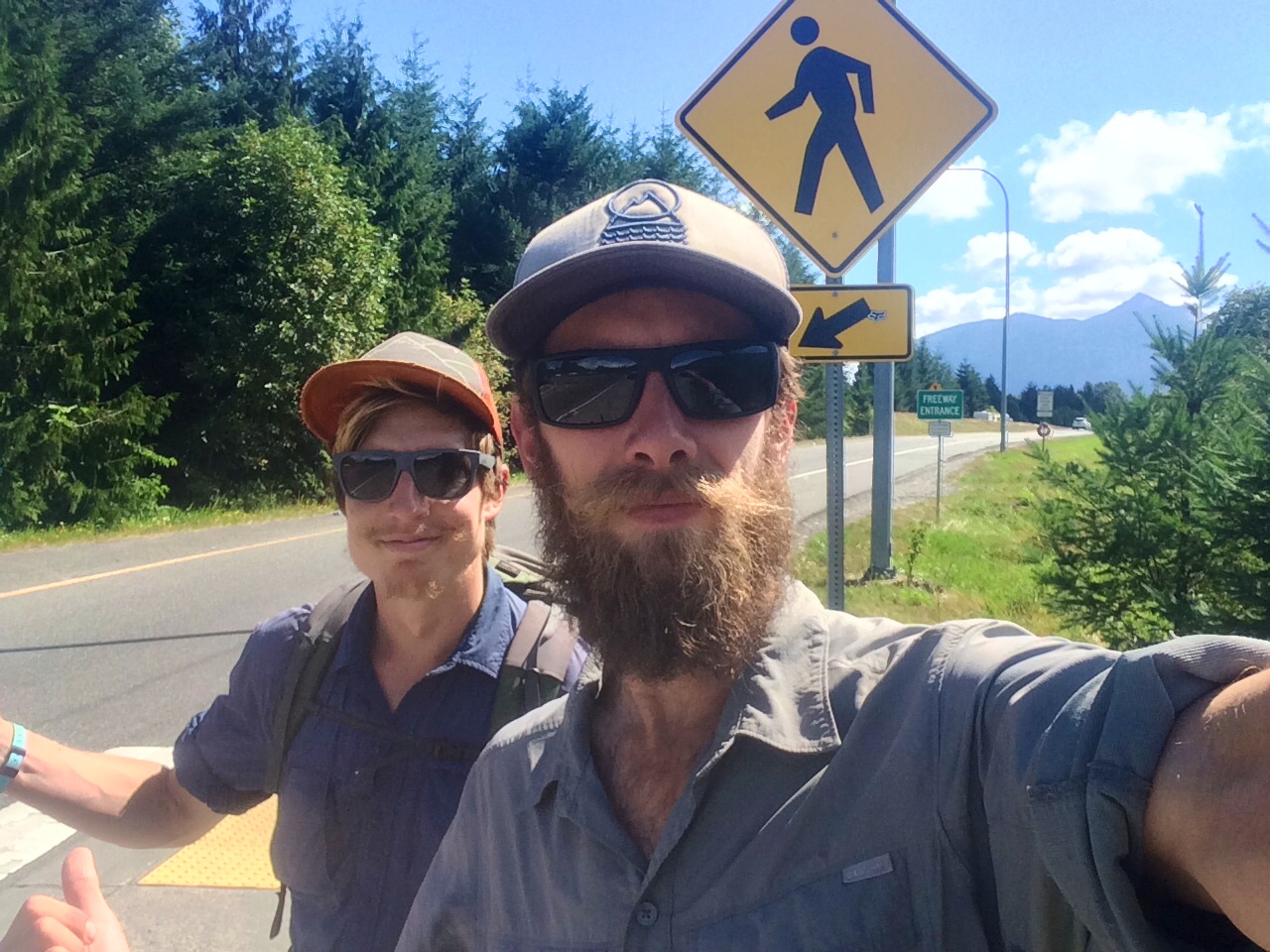 Sick Soapbox and trusty friend, Pedi hitching to get back to the trail from North Bend.