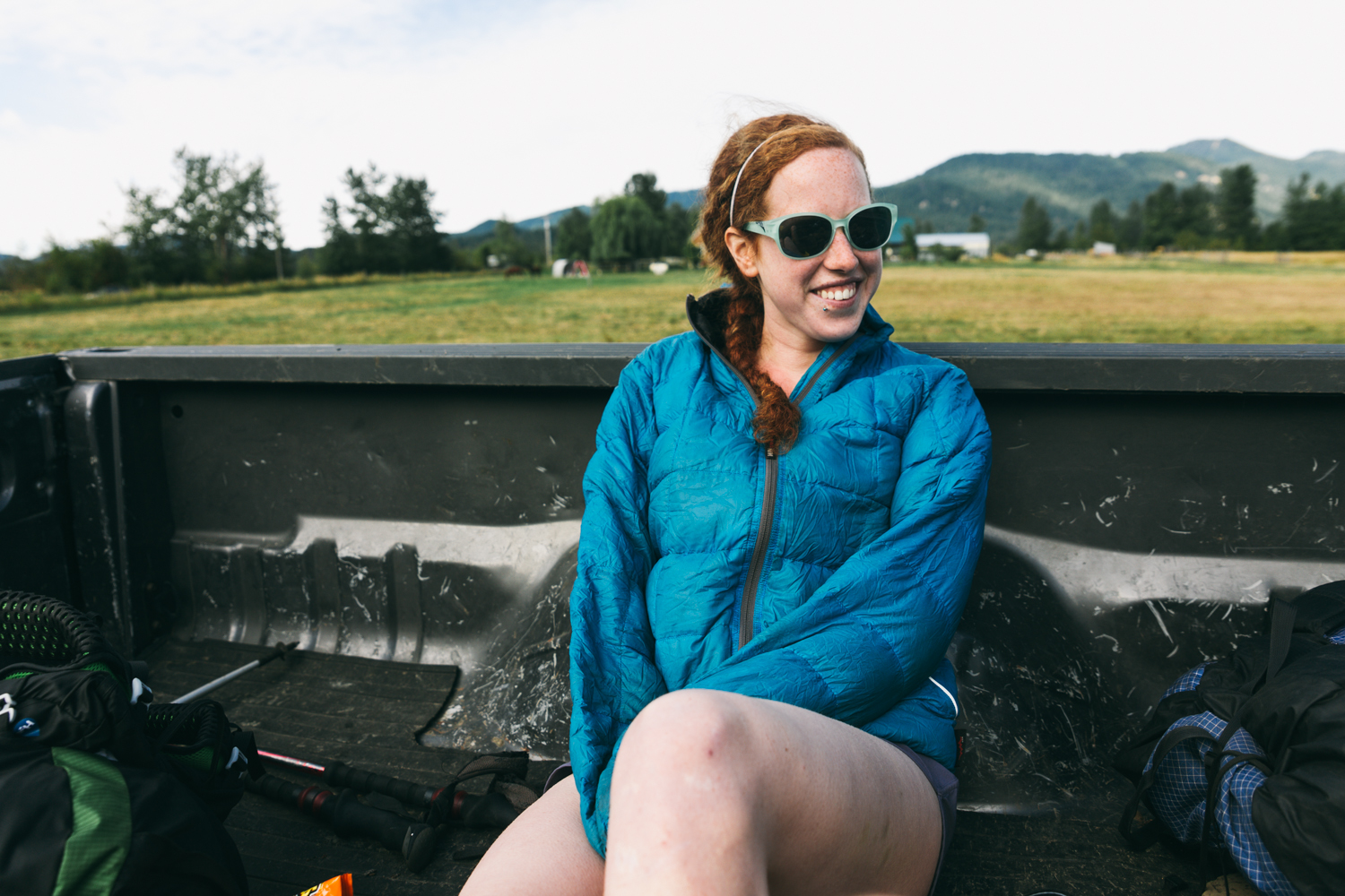 Frizzle riding in the bed of a pickup on our way back to trail from Trout Lake, WA