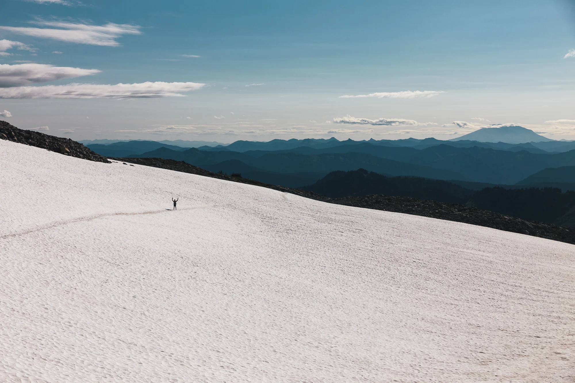 Smitty traversing a snowfield in Goat Rocks.