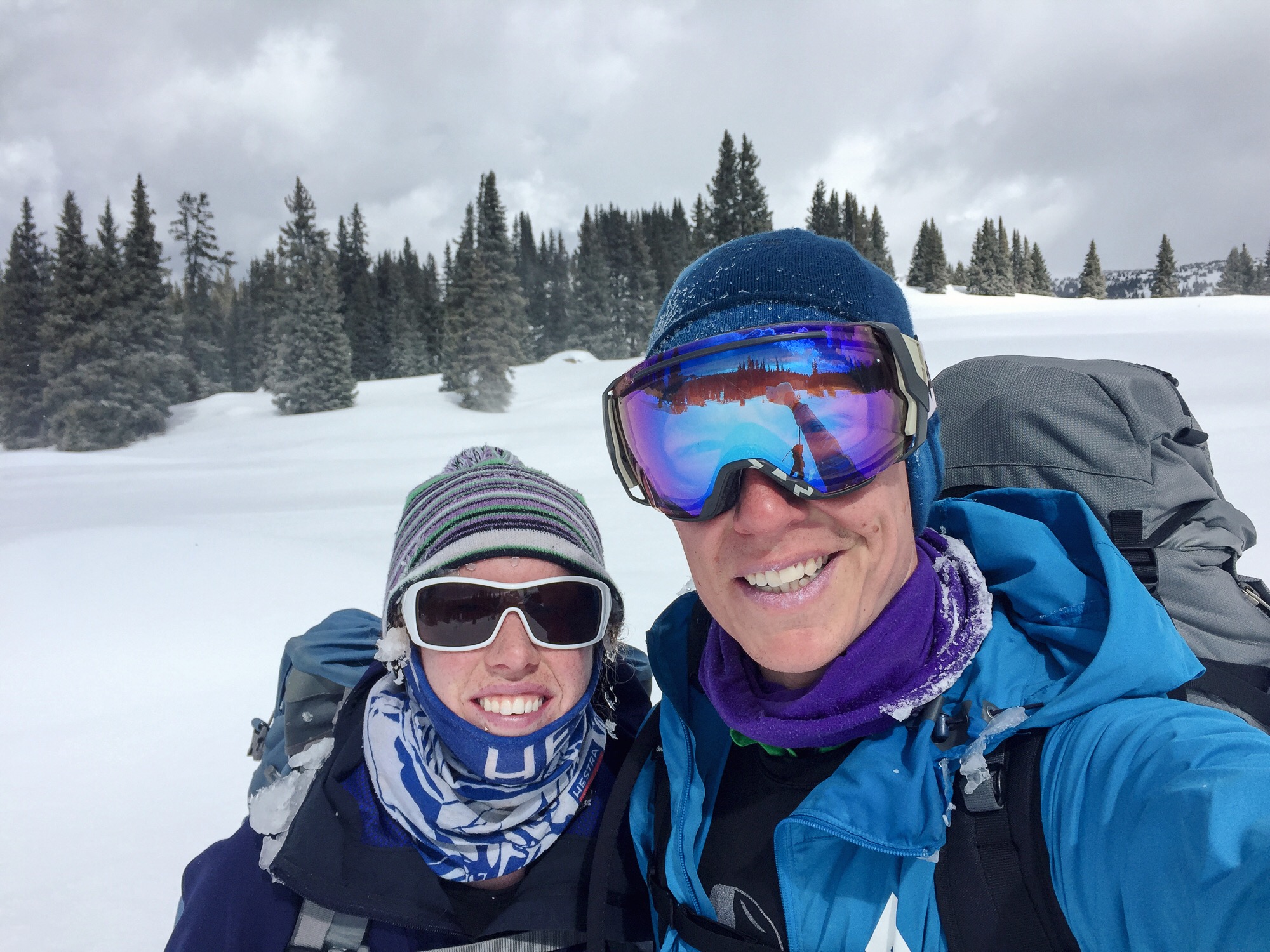 45 minutes later and safely on the other side of the pass, it was like a whole new world. Sunshine and calm winds made it quite delightful. (note the giant ice chunk still stuck to Molly's face from going over the pass.)
