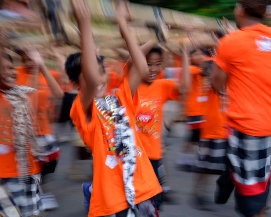 'Nyepi lads' © Naida Ginnane 2015 Nikon D800, 24-70mm lens. f/2.8, 1/13, ISO 100 I love the way the blur in this shot captures the boys' movement as well as the sheer joy on their faces.