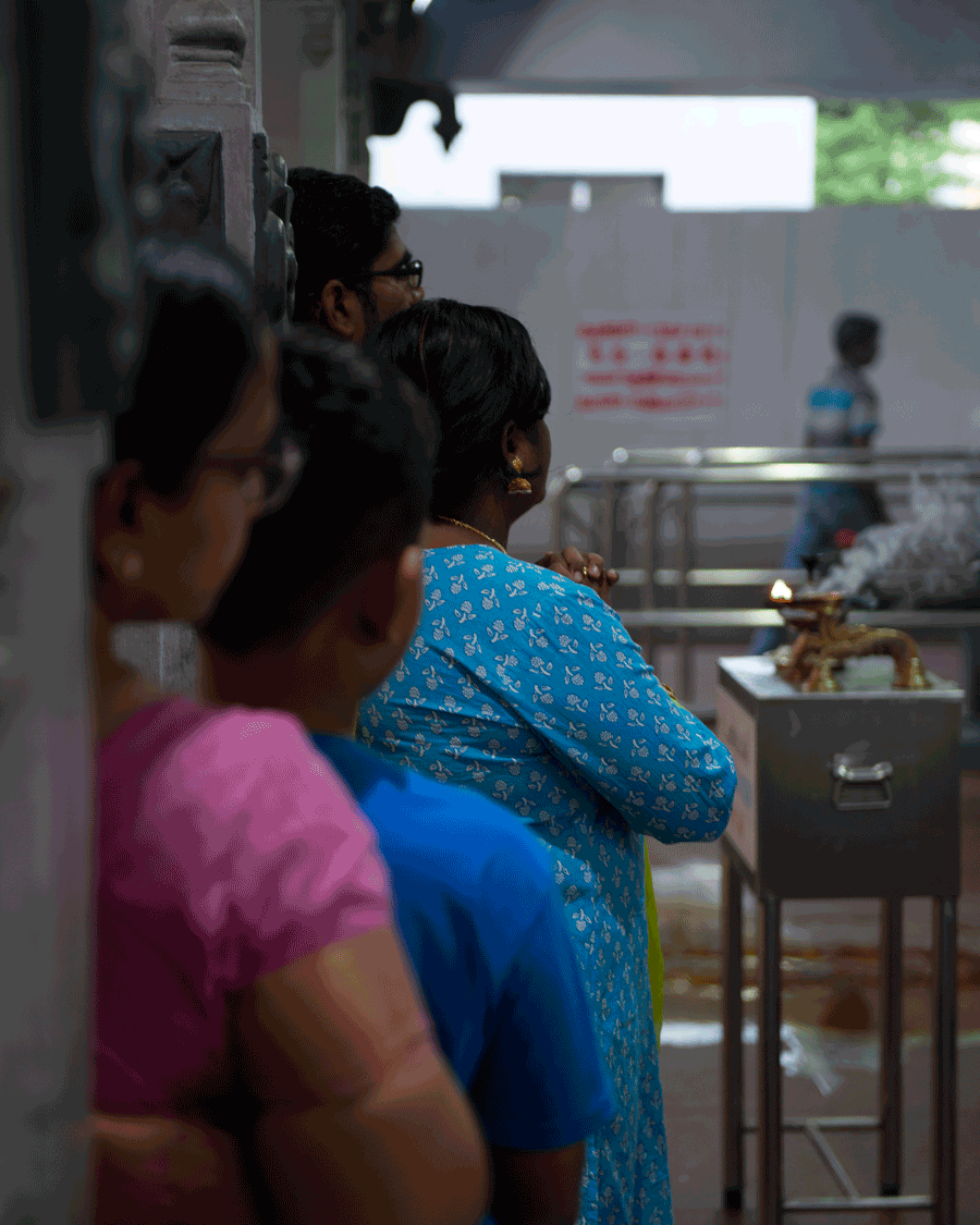  'Watching' © Naida Ginnane 2018 Nikon D800 24-70mm lens, 1/ 50, f/2.8, ISO 250. As these women watch a Hindu ritual, I used a small f/stop to focus the attention to a narrow DOF.