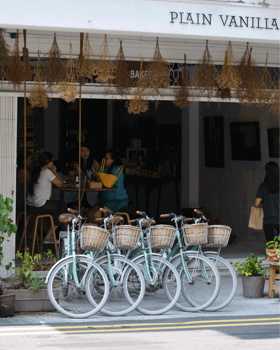  'Vanilla' © Naida Ginnane 2018 iPhone X 1/ 80, f/10, ISO 100. Regular repeition of the dried flowers and the bicycles makes an inviting cafe scene.