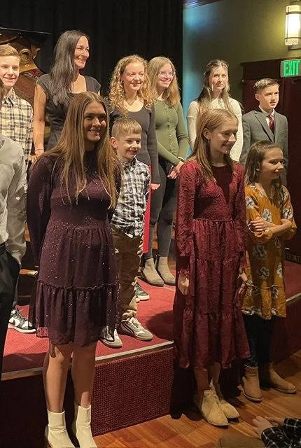 An image of the piano students after a recent recital