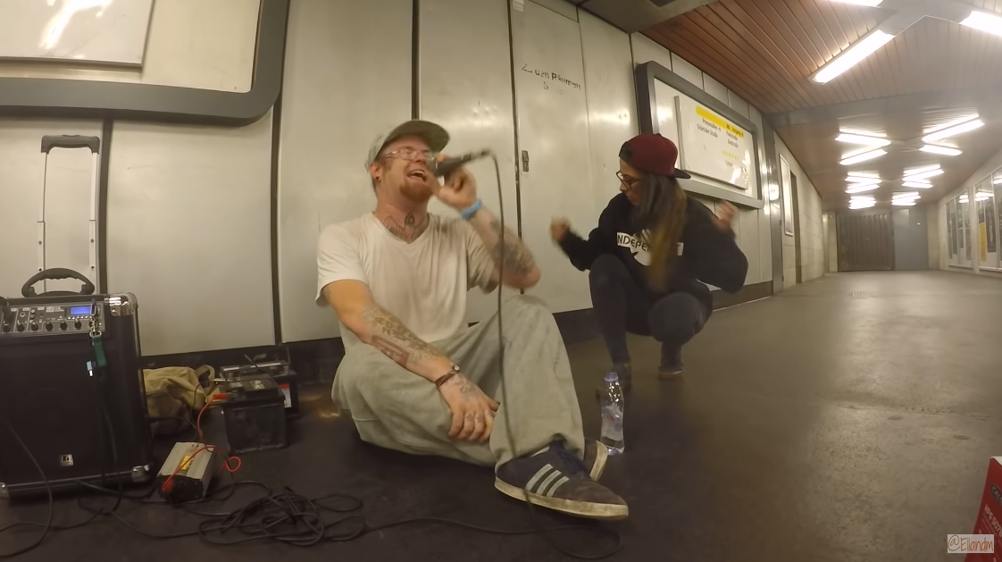 Girl joins rapper in the subway