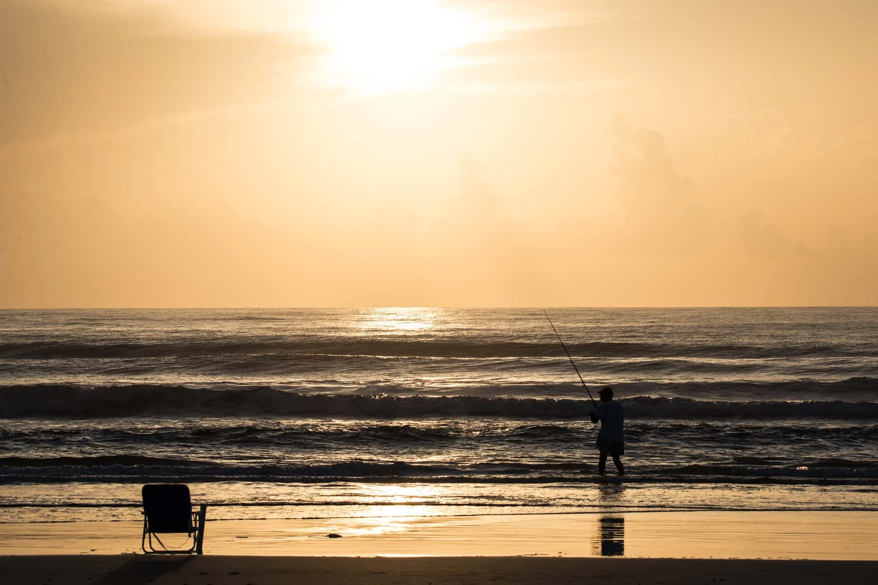 A lone fisherman tries his luck on the Florida Coast, Atlantic side.