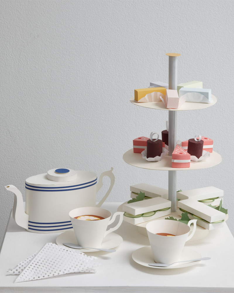 afternoon tea set with cake and cucumber sandwiches