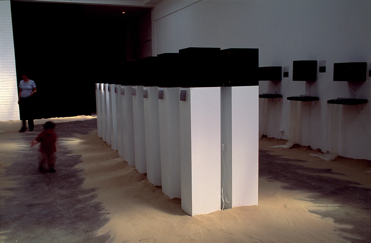 Exhibition of diptych light box and specimen tray. Lightboxes on pedestals.