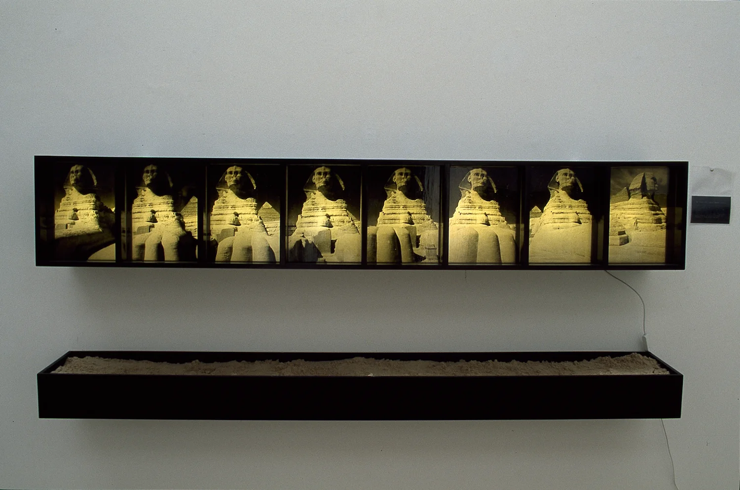 Large lightbox of Sphinx turning with accompanying sand box