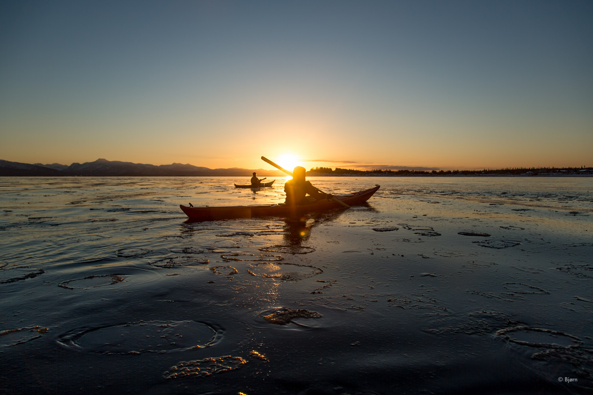 Kim and Hig Kayak Into Mid-Winter Sunset