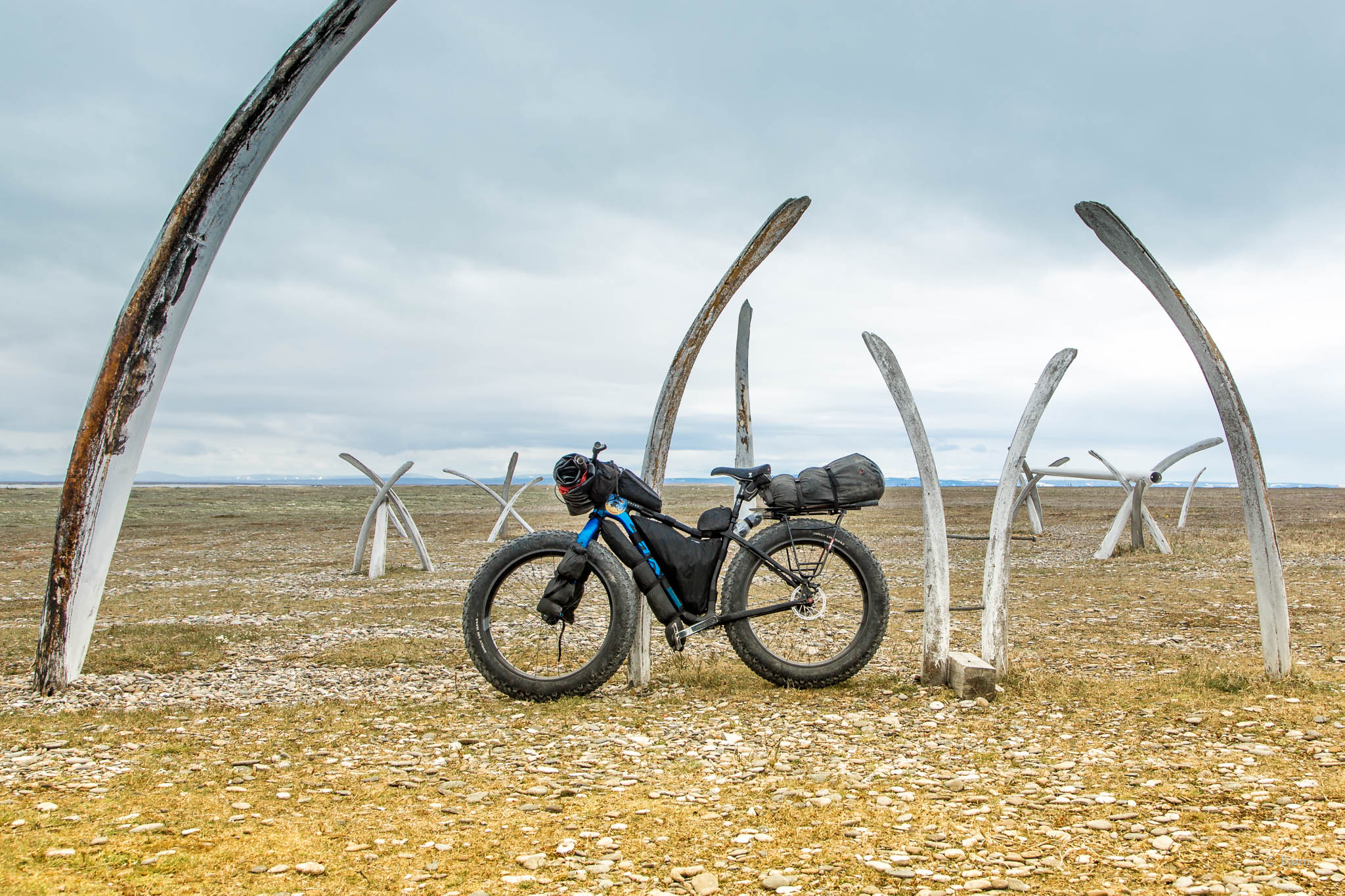 Salsa Mukluk fat-bike in front of whale bones - Point Hope, Alaska. 
