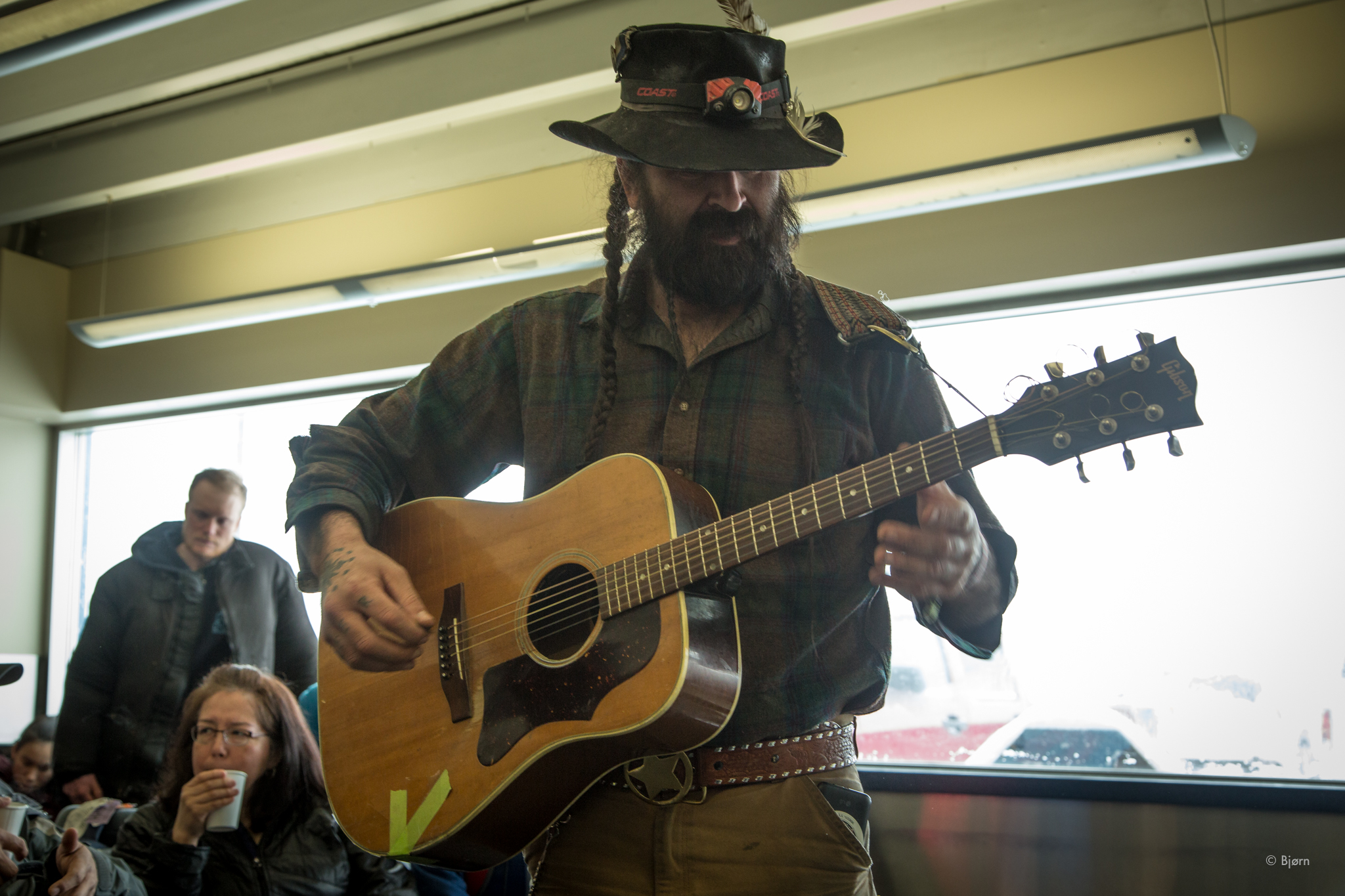 Justin Boot serenaded Tim Osmar, and the rest of us, in the airport, with a song he'd written about Tim's father, Dean. 