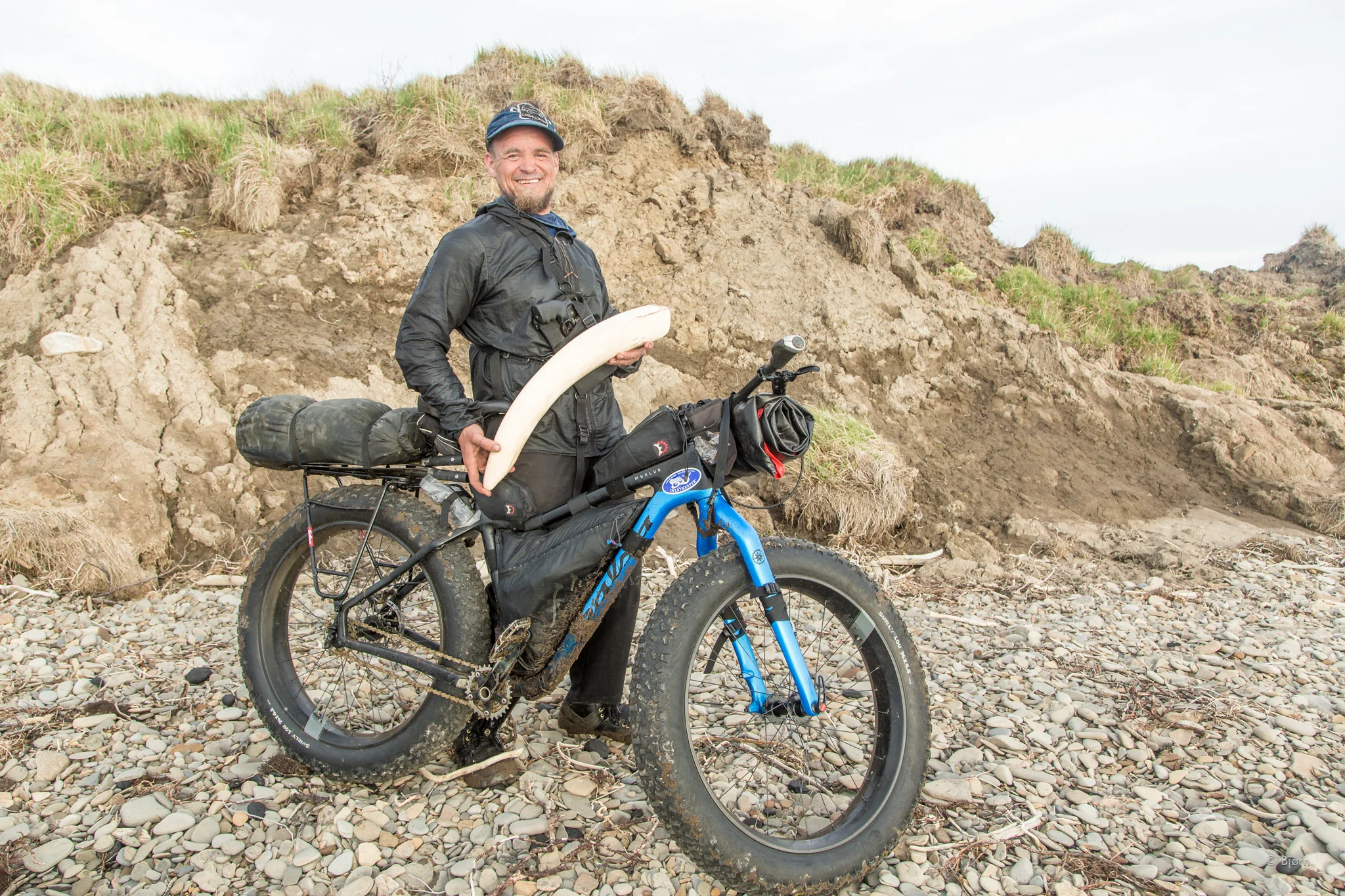Bjørn poses with a mammoth tusk he found while riding his Salsa Cycles Mukluk fat-bike in the Arctic of Alaska. 