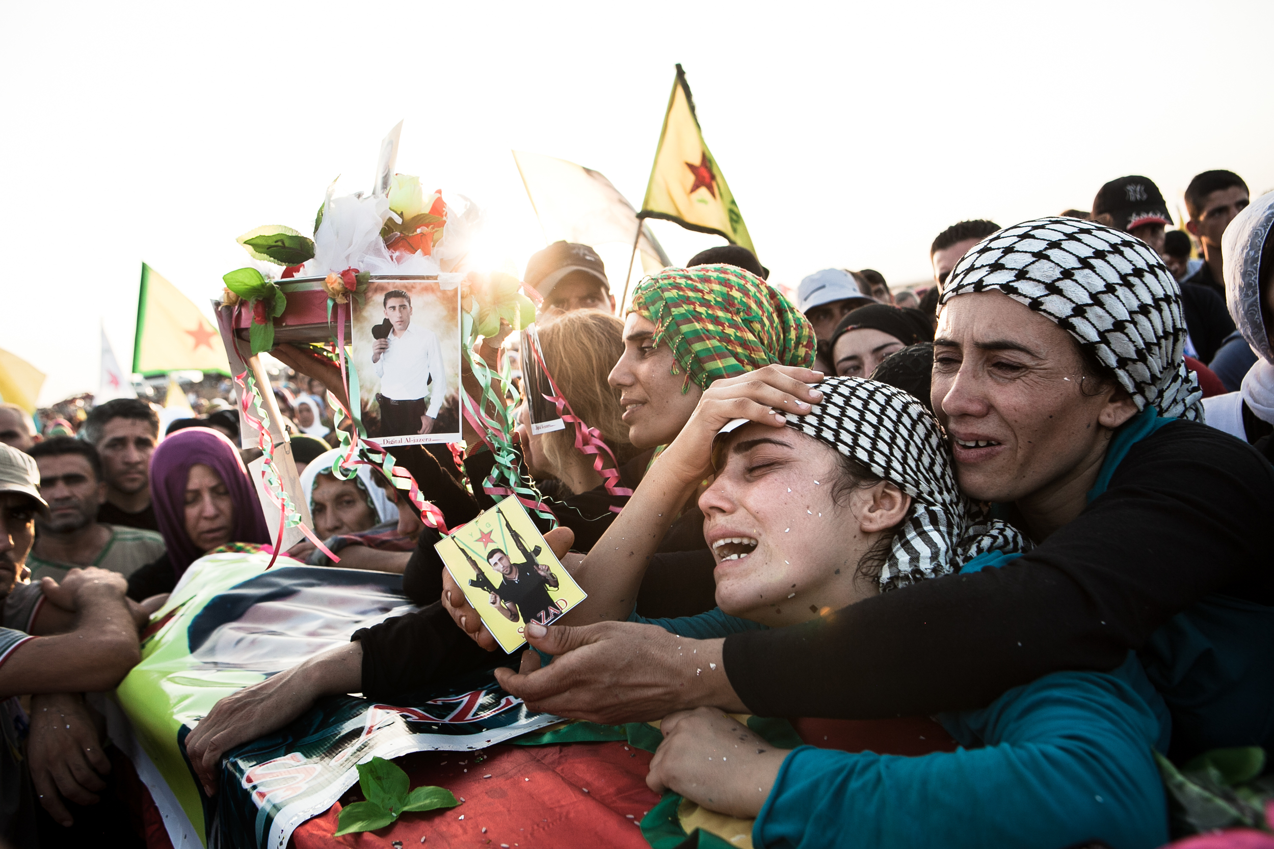  A family mourns for a YPG soldier who was killed in action while fighting against ISIS along the Syrian-Iraq border. 