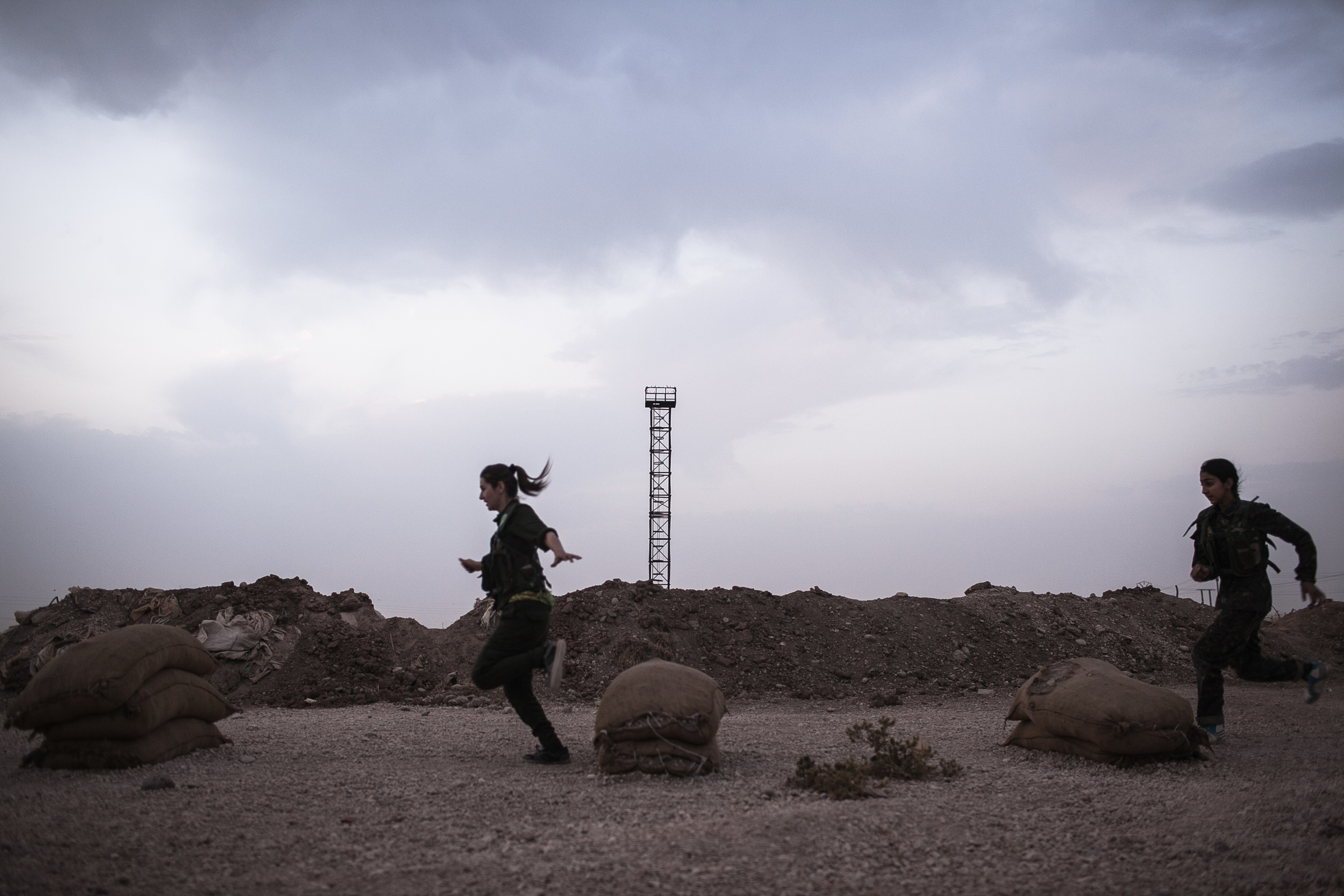  YPJ recruits exercise at dawn, near Derek City, Syria.  