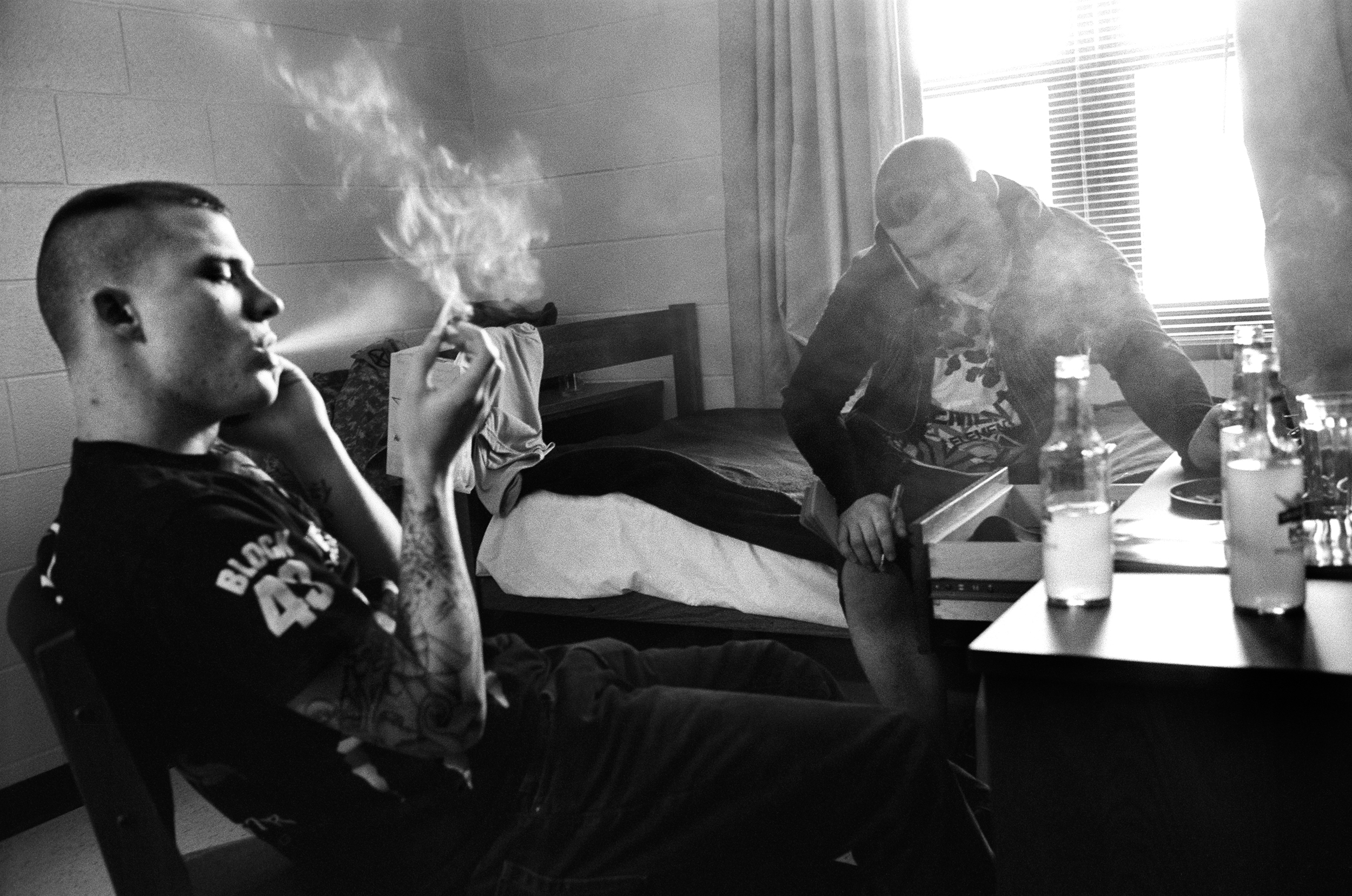  SPC Ryan Cooley and SPC Adam Ramsey smoke cigarettes in the barracks at Fort Drum, New York,&nbsp;2010. 