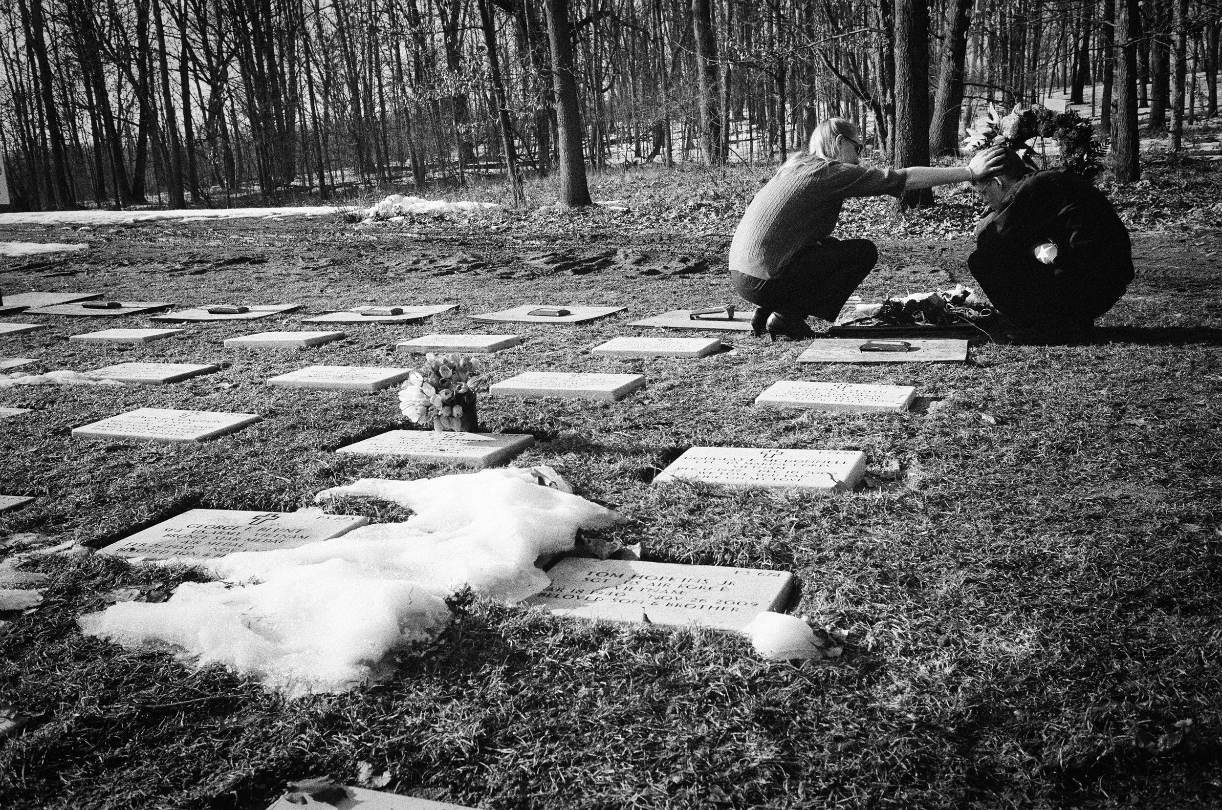Tess Terpstra comforts her brother, Brandon, after the funeral of their brother SPC Dirk Terpstra at Ft. Custer National Cemetery in Augusta, Michigan, 2010.
