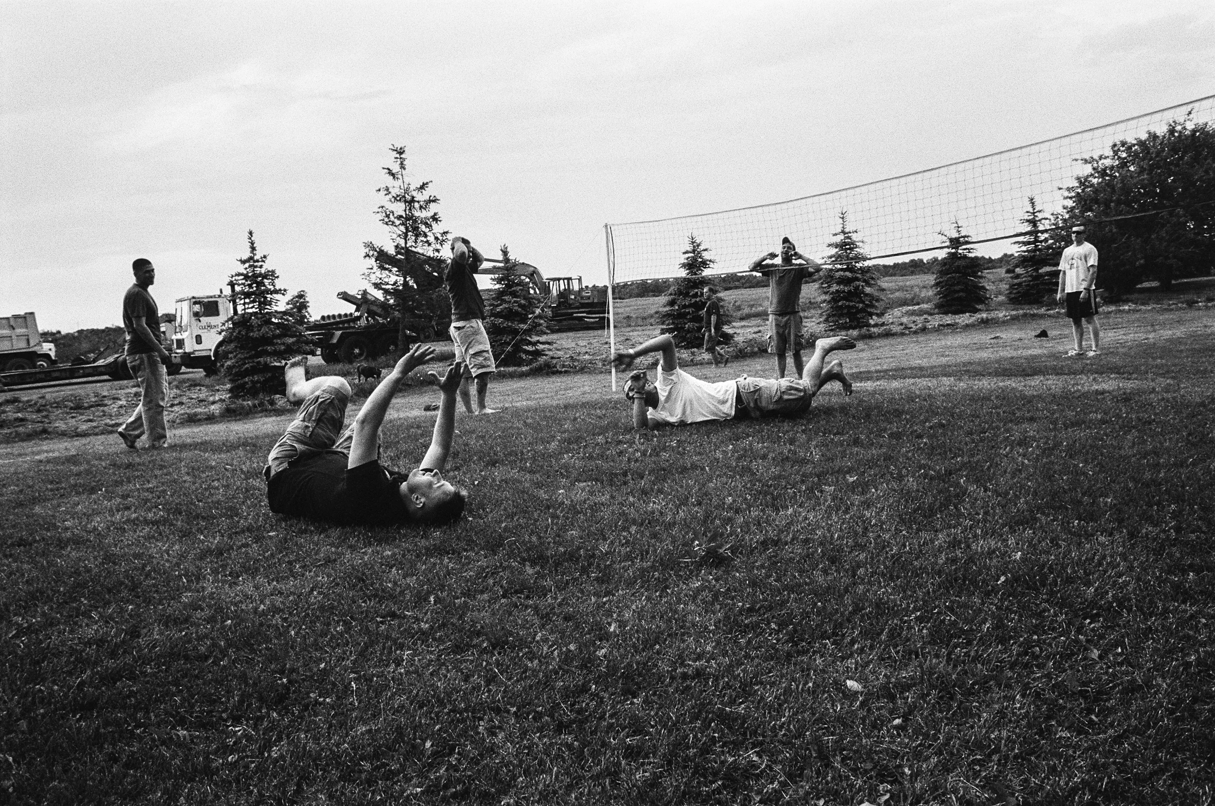 Soldiers play volleyball during a backyard BBQ in Watertown, NY, 2010.