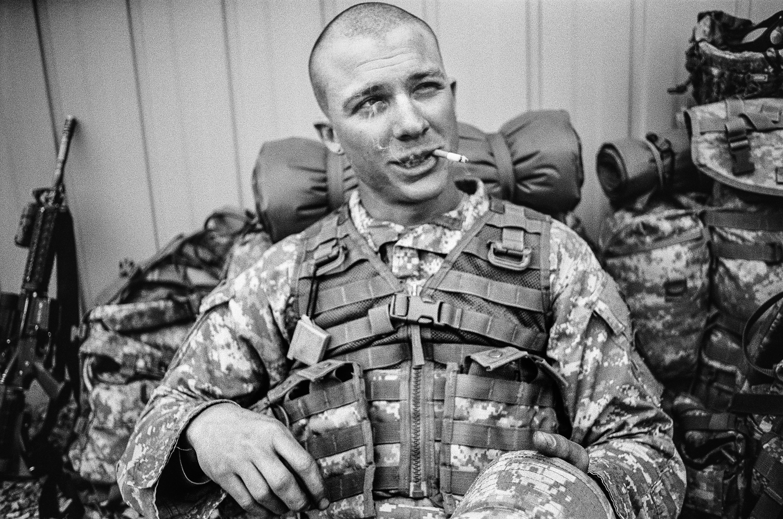  SPC Ryan Cooley smokes a cigarette while on a break during training drills at Fort Drum, New York, 2010.&nbsp; 