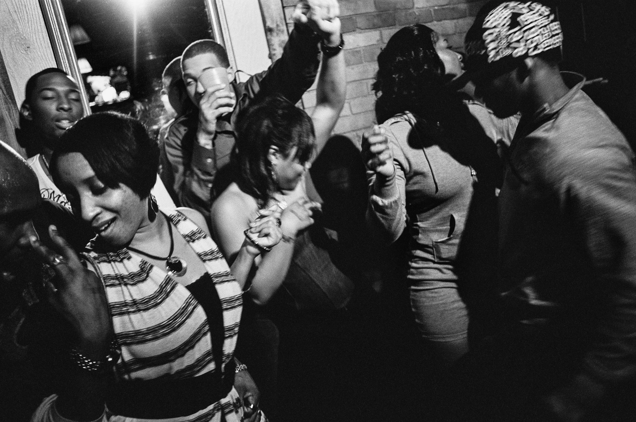 Soldiers from the 10th Mountain Division and civilians drink and dance at Maggie's bar in Watertown, New York, 2011.