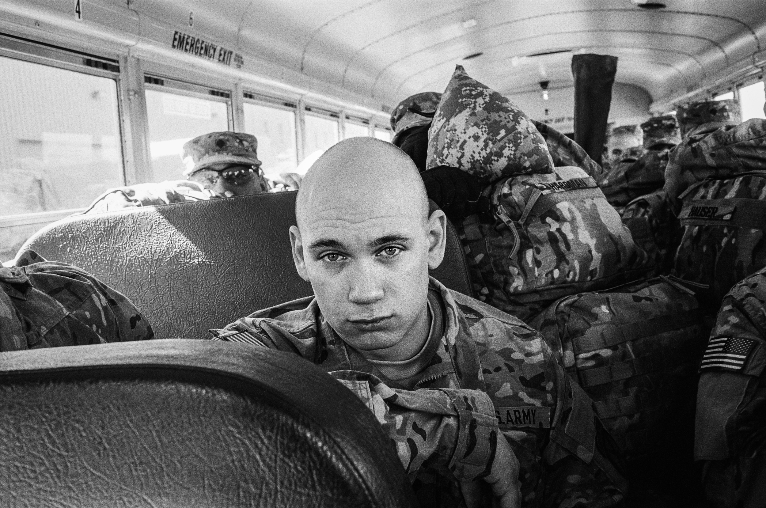 A soldier waits on a bus before deploying to Afghanistan,&nbsp;at Fort Drum, New York,&nbsp;2011. 
