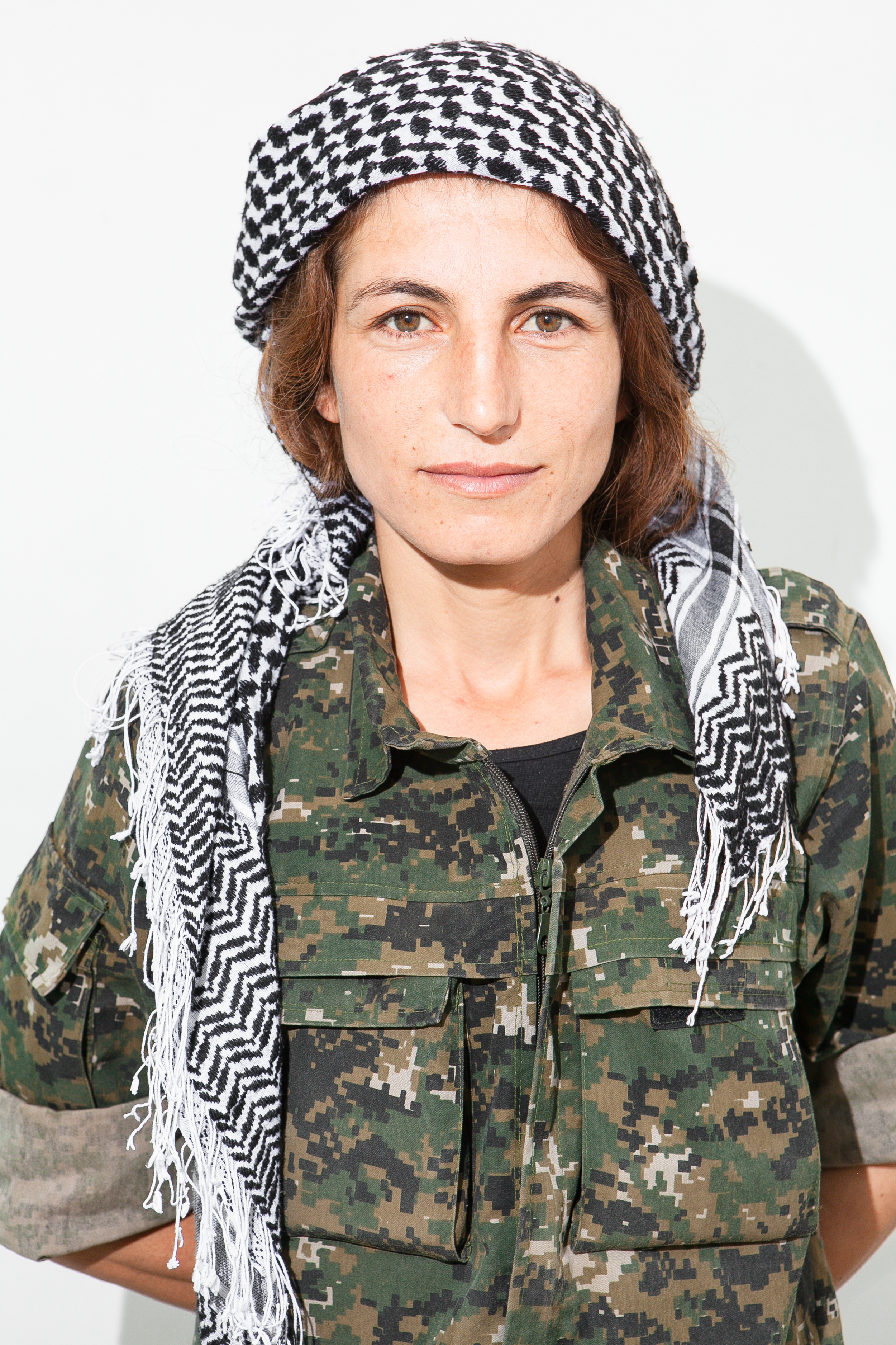 Evin Ahmed, 28.   "We defend everyone in Rojava no matter what race or religion they are.  We are very strong women, we aren’t afraid of anything. I love being a YPJ soldier, I love the other soldiers, we are closer than sisters. This is the only li