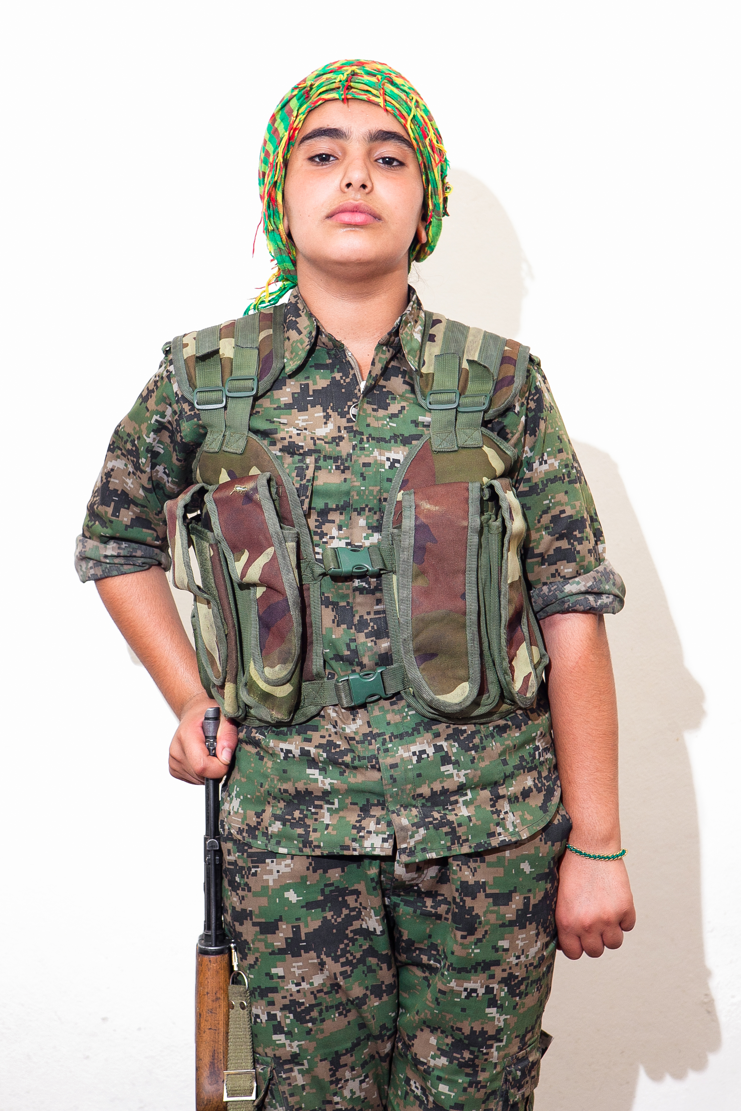  Hevedar Mohammed, 12.   “One day I went home and told my mother that I wanted to join the YPJ.  At first she said no, because I was too small, but she finally said I could.  My father said he was very proud of me. All of the soldiers tell me they lo