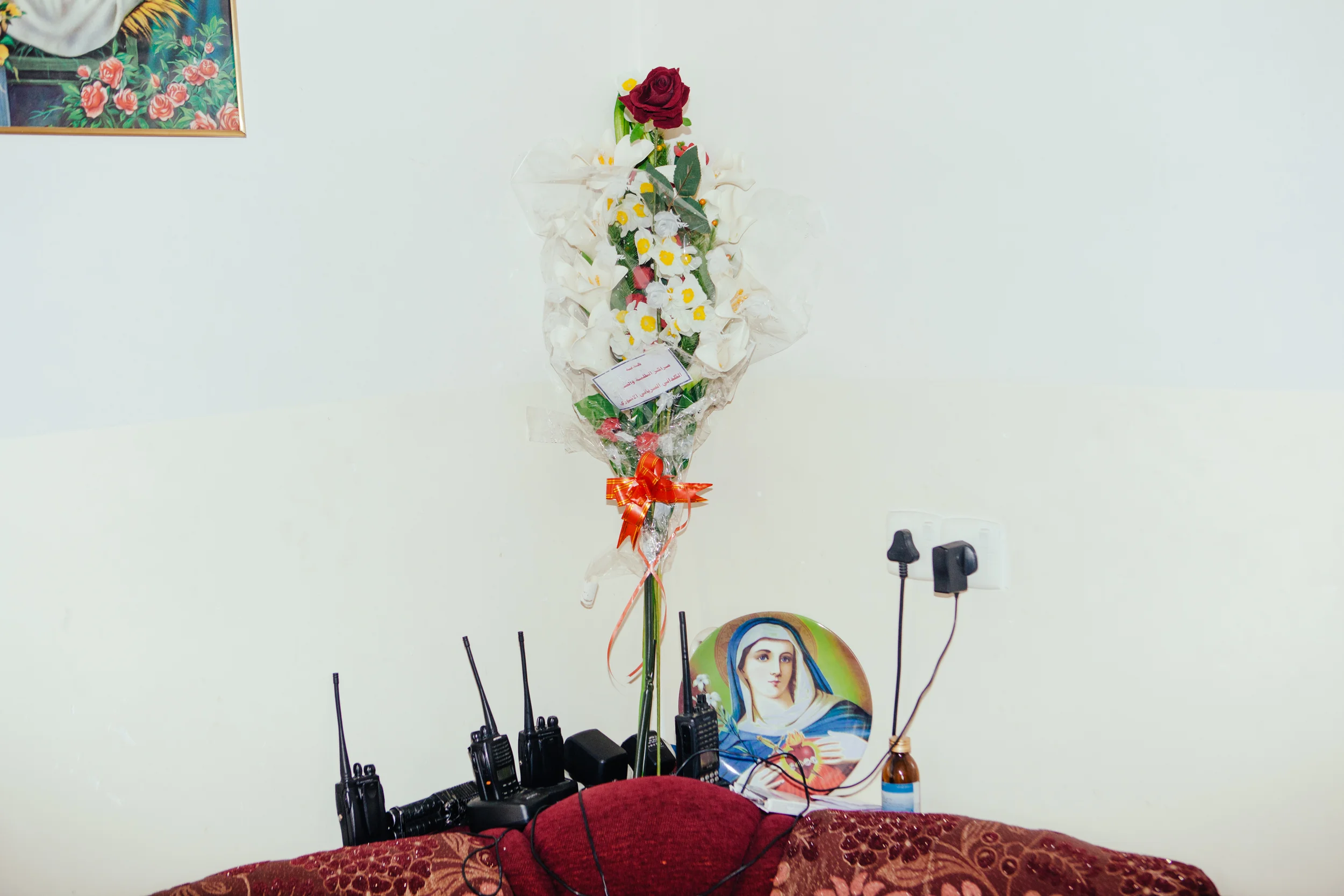 Flowers and radios adorn the walls at a Dwekh Nawsha military base near Baqofah, Northern Iraqi Kurdistan. 