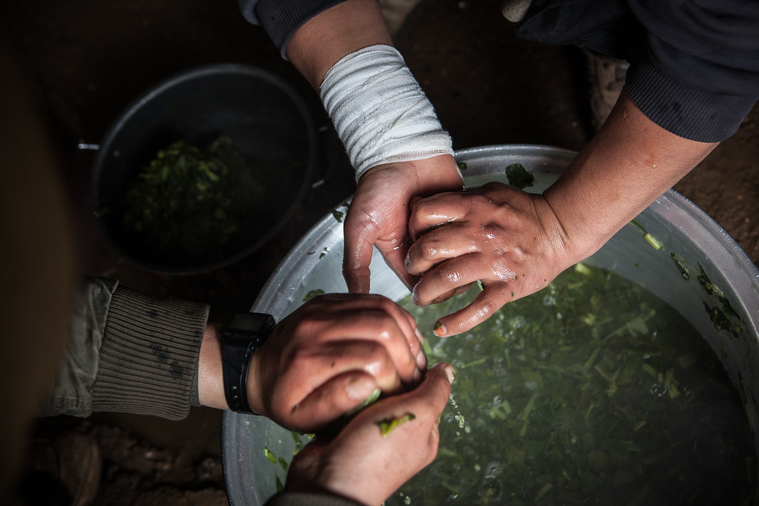  YPJ soldiers cook dinner at their base near Sinjar, Iraq.  