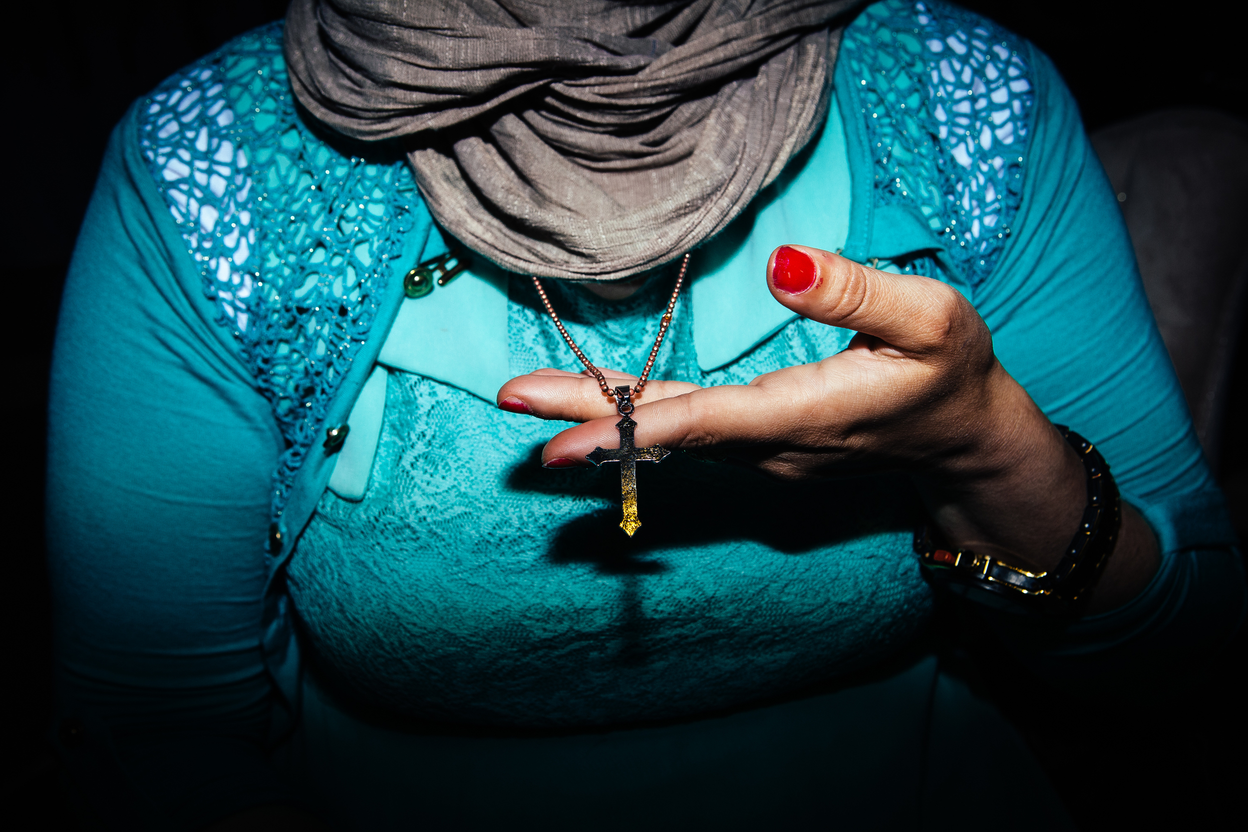  An Assyrian Christian woman shows her cross necklace at a Christian revival in Dohuk, Northern Iraqi Kurdistan.&nbsp; 