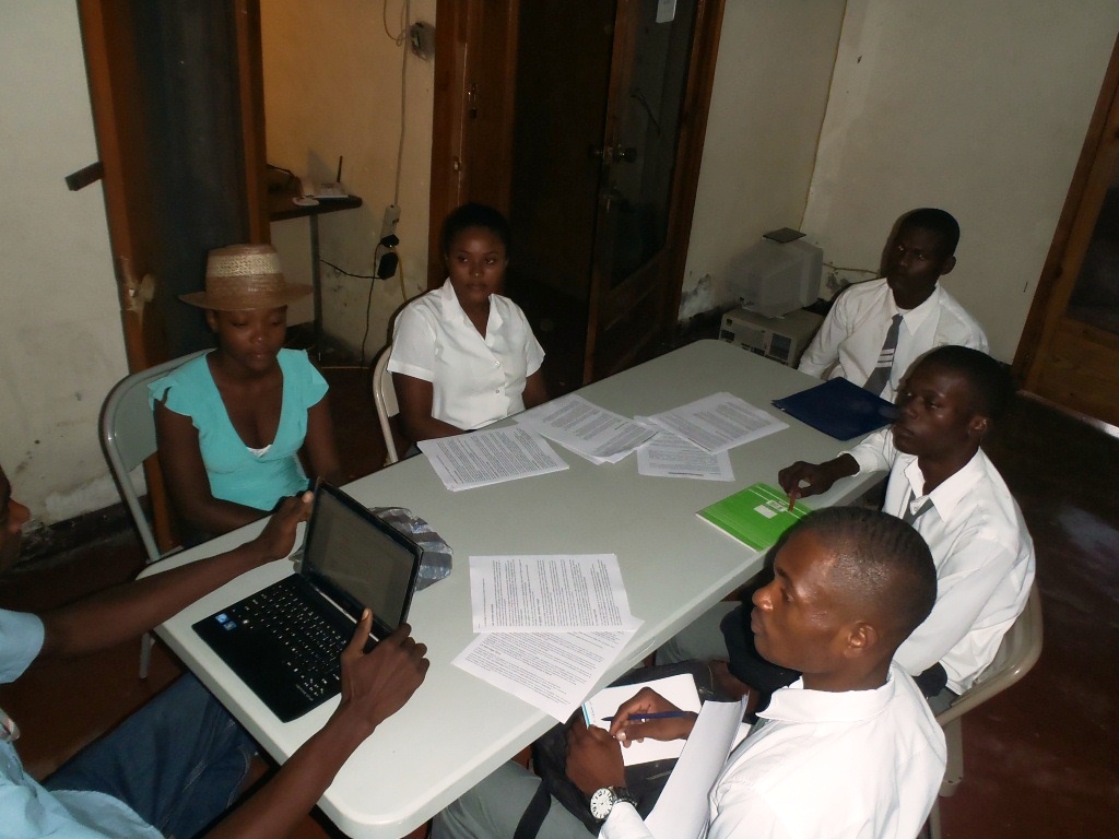 H.S. interns at Radio Boukman learning how to broadcast