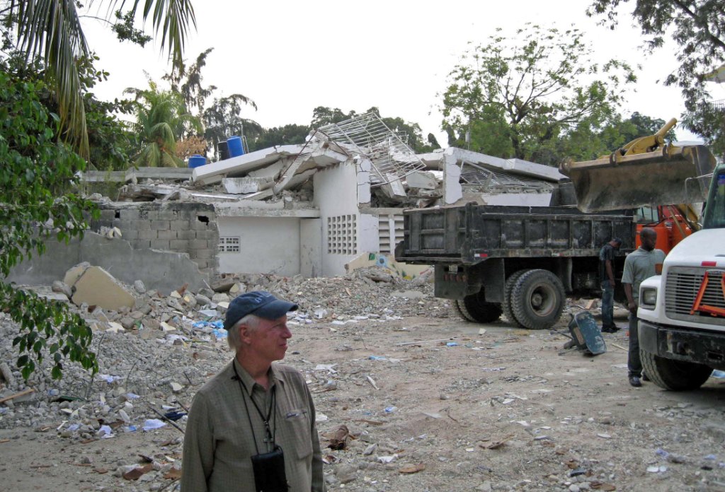 Fr. Tom views the cleared away rubble from the residence. 