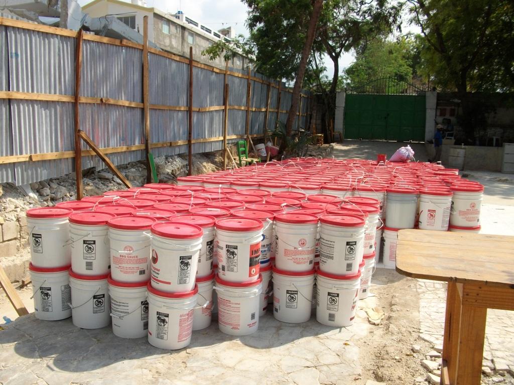 Buckets filled with food at our compound being readied for distribution to families living in nearby tent cities