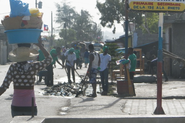 Project Dismas cleaning sewage in Cite Soleil