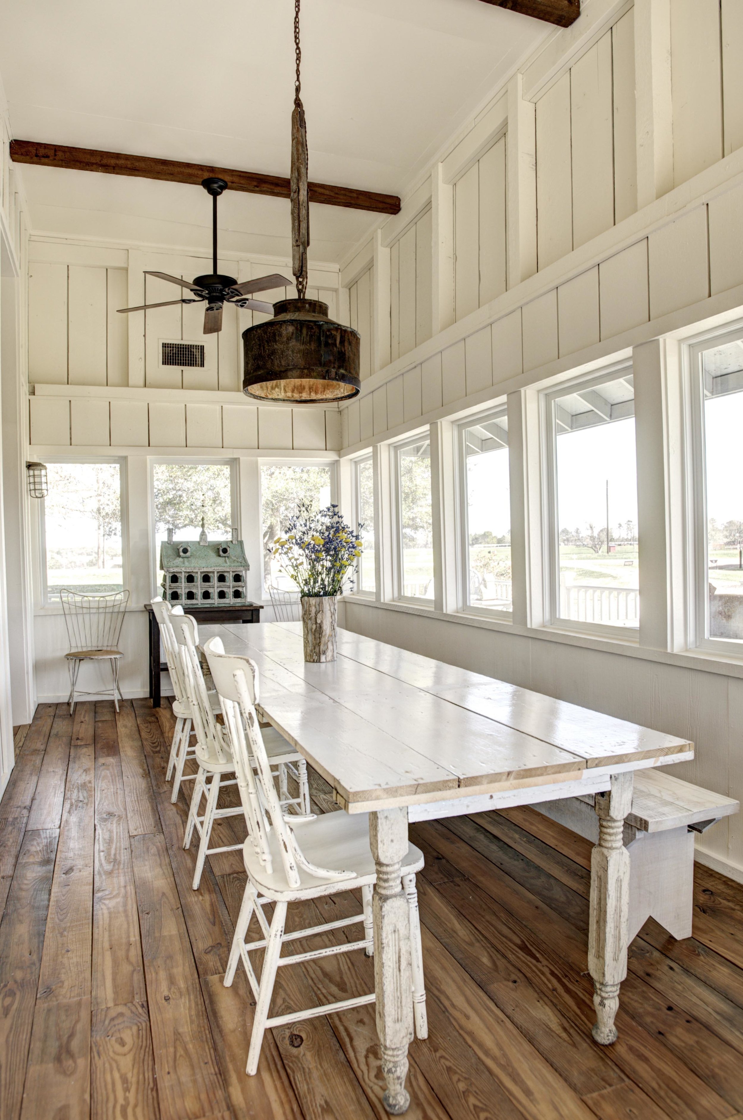   Enclosed sunporch dining area with seating for up to 8 guests.  