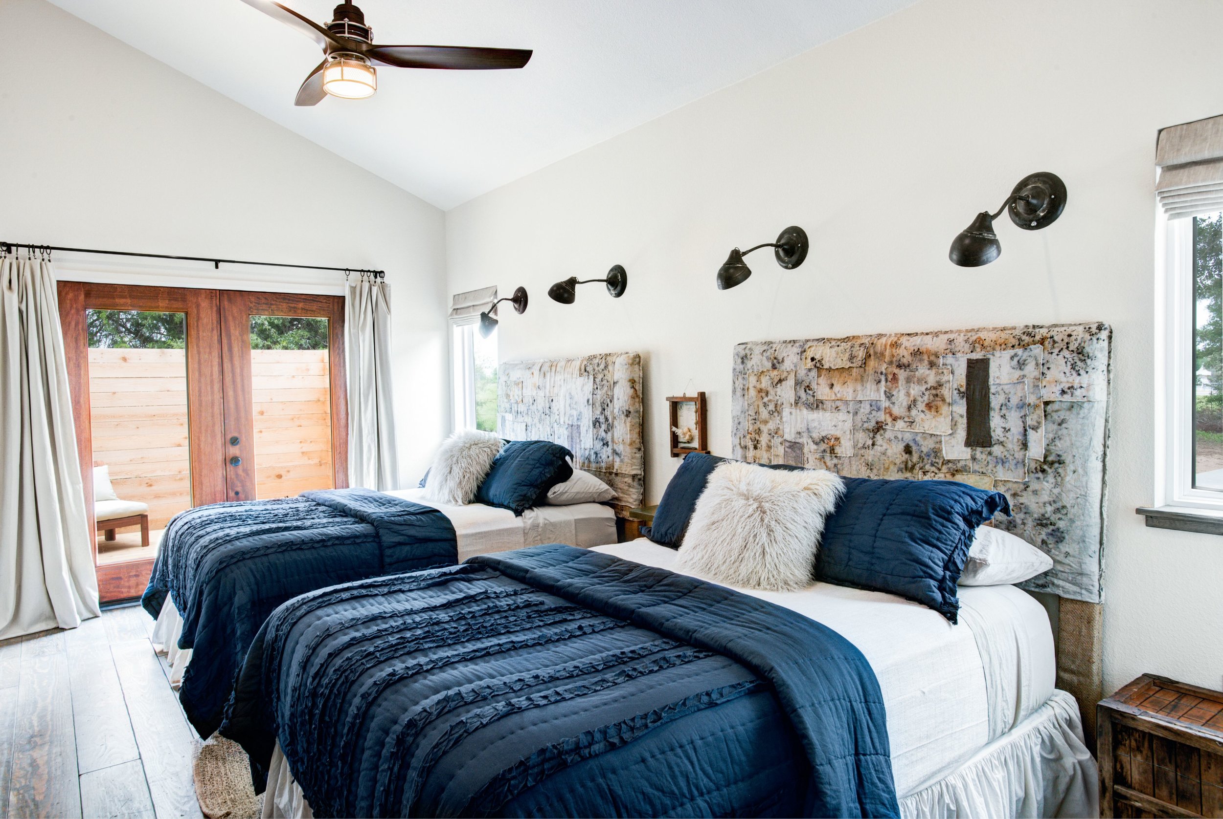   The Boho guest bedroom features two queen-sized bed, ensuite full bath with soaking tub and shower, and a private ensuite patio.  