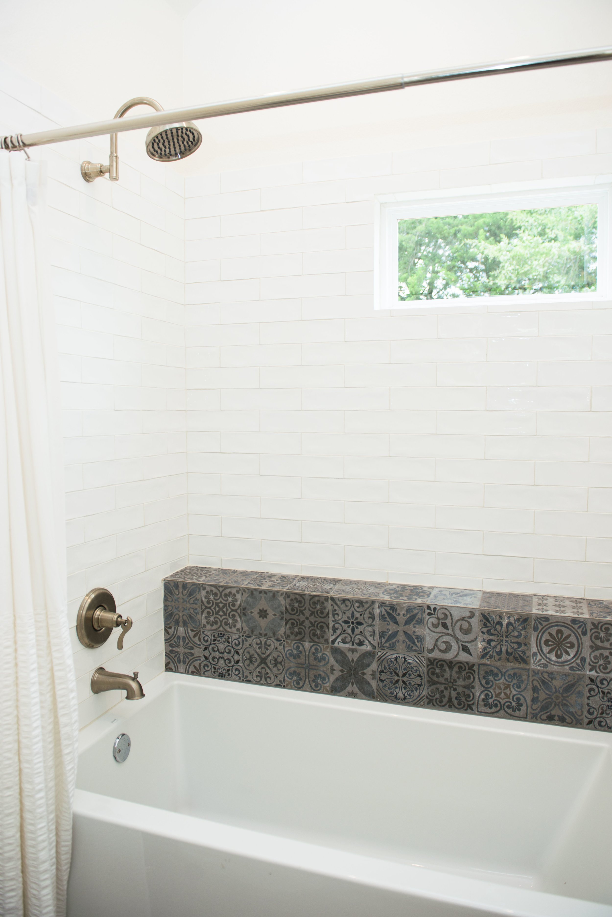   The Boho guest bedroom bath features a soaking tub and shower.  