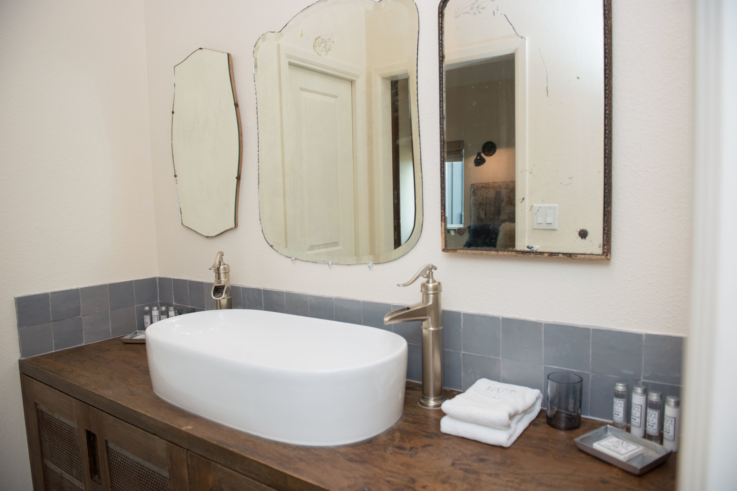   The Boho guest bedroom bath features a soaking tub and shower.  