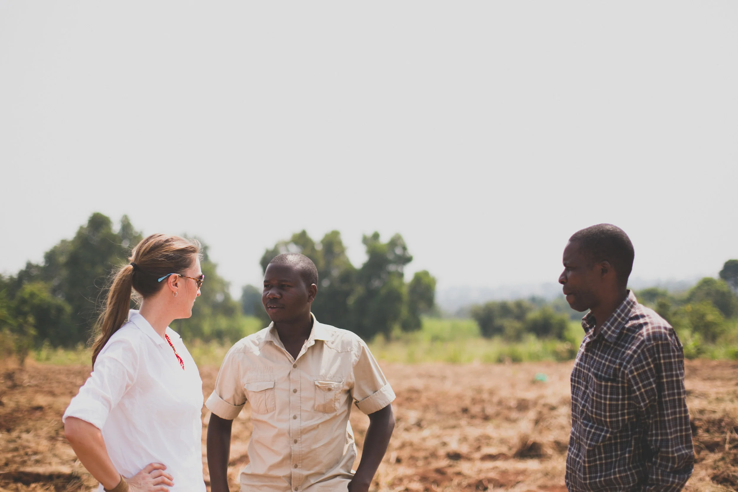Kim, Isaac, and Godfrey at the Grow Hope compound, Tusubira Village
