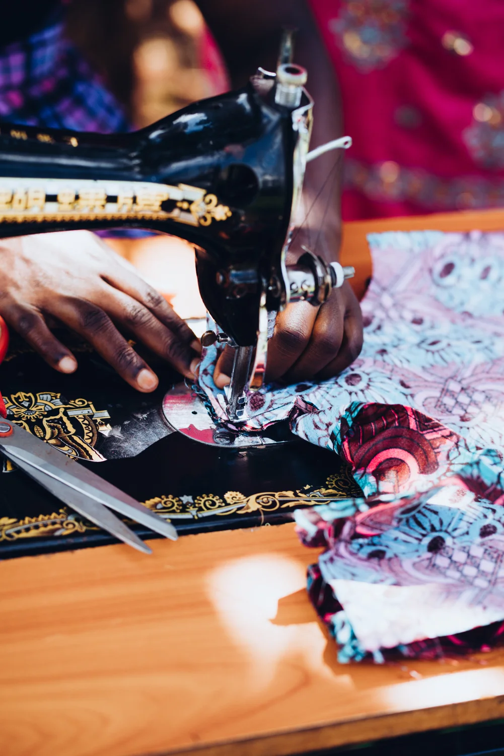 Women learn a variety of skills in our Tailoring Program.