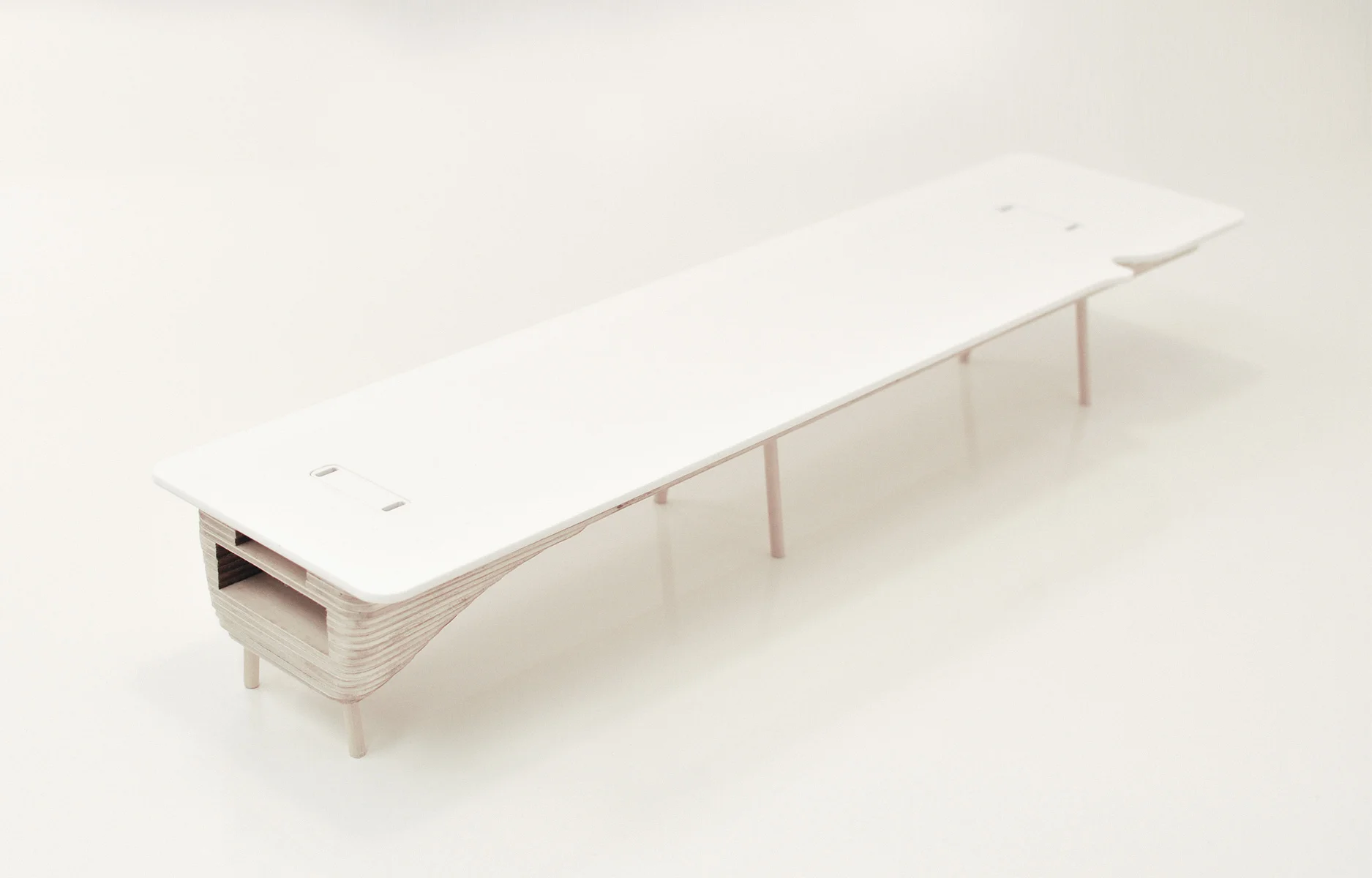 Created for a workplace environment, Bean Belly is a conference table that incorporates and conceals all IT and AV equipments inside a sculptural belly shaped table base. Inspired by the organic shapes of bean pods, the table is uniquely designed and manufactured using CNC cut layers of plywood. All sockets are concealed around the perimeter sides, which allow the table top to be kept free of clutter. It also has a Bean Buro signature curve detail around the edge. Two sizes were designed for Leo Burnett, a large size for 11 seats, and a small size for 4 seats.