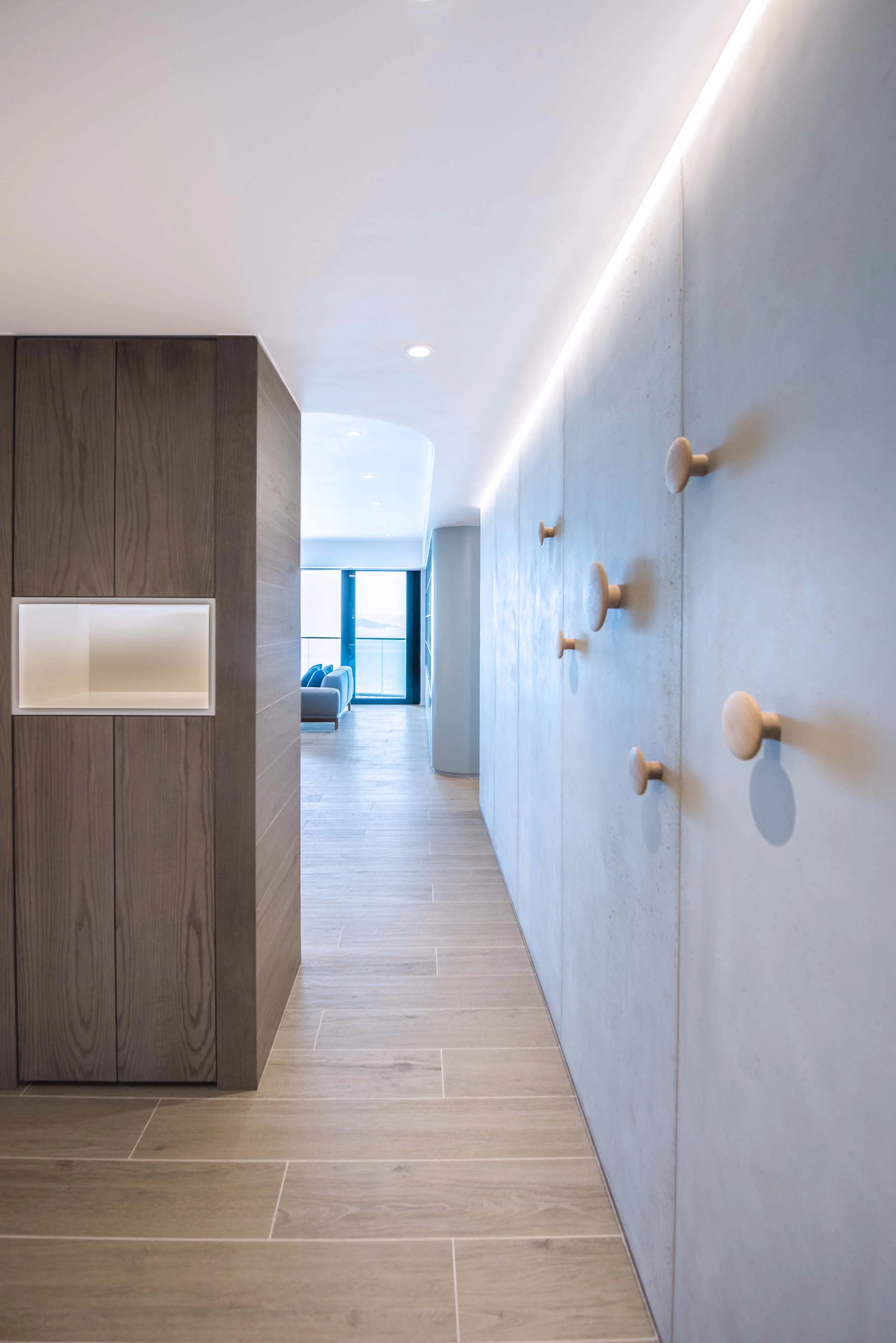 The concrete panels used in the project were prefabricated from France which could be easily cut and assembled quickly, cutting down on site construction time. A long continuous LED light strip accentuate the concrete panels, controlled by the overall scene lighting control system for the apartment.