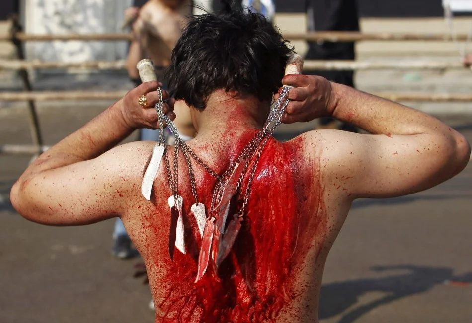 afghan-shiite-muslim-flagellates-himself-during-ashura-procession-kabul-november-14-2013.jpg