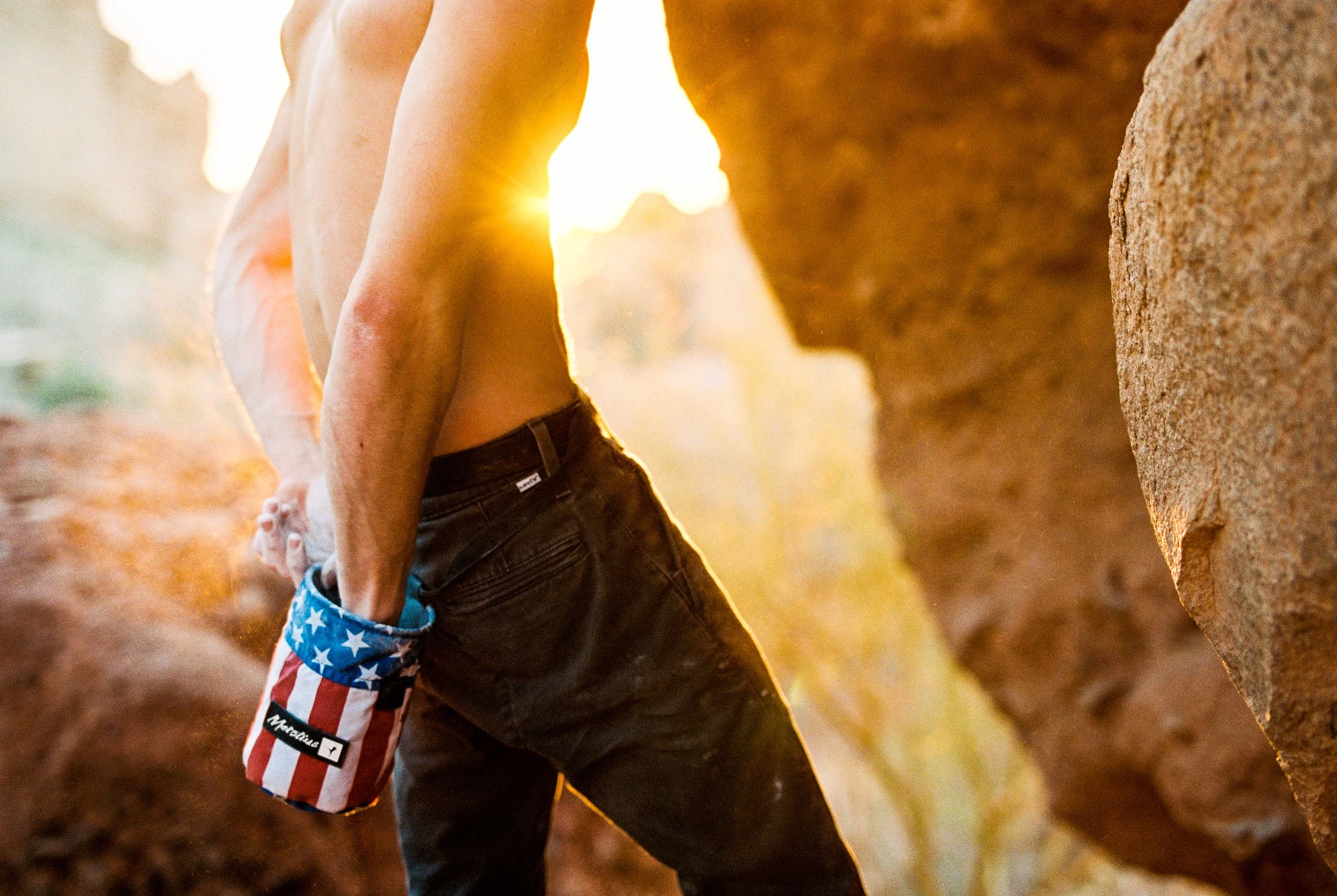 climber chalks up
