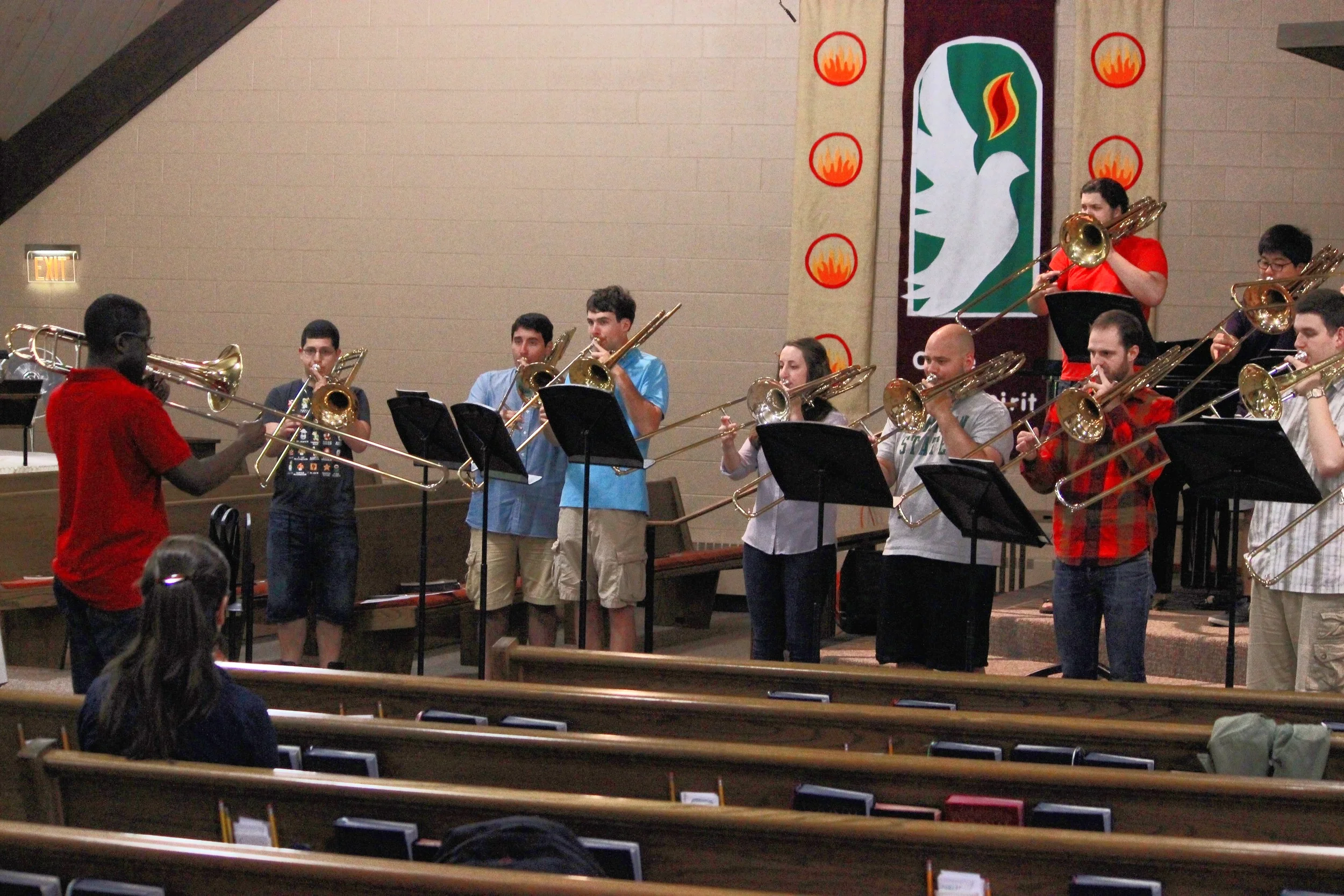 Guest Artist Kenneth Thompkins, Principal Trombone of the Detroit Symphony leads a morning warm-up session.