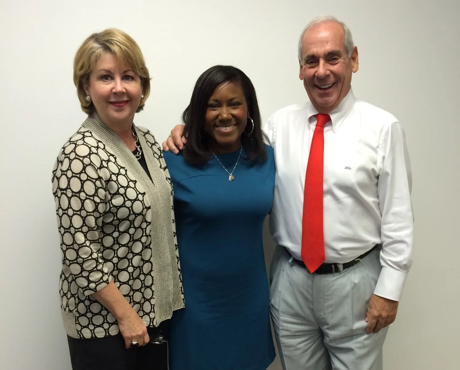 Cheri Fama (JDR President/COO), Aisha Crumbine and John Daugherty (JDR Chairman/CEO and Founder)