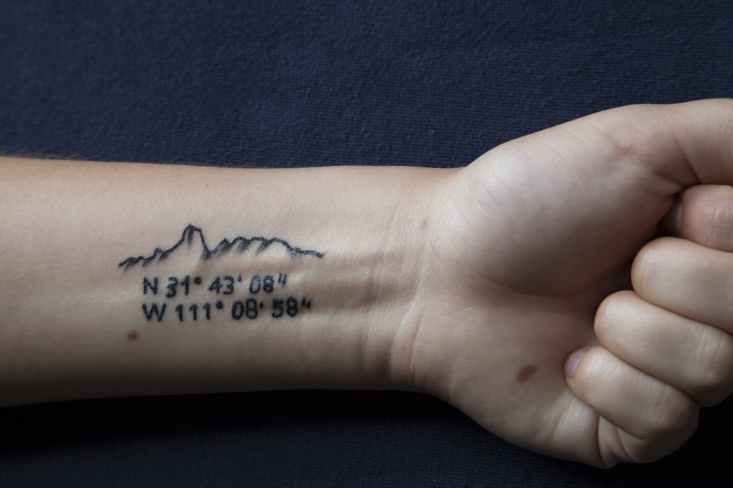  Tattoo #3, 2012 - Tattoo depicting Bavoquibari Mountain and GPS coordinates 